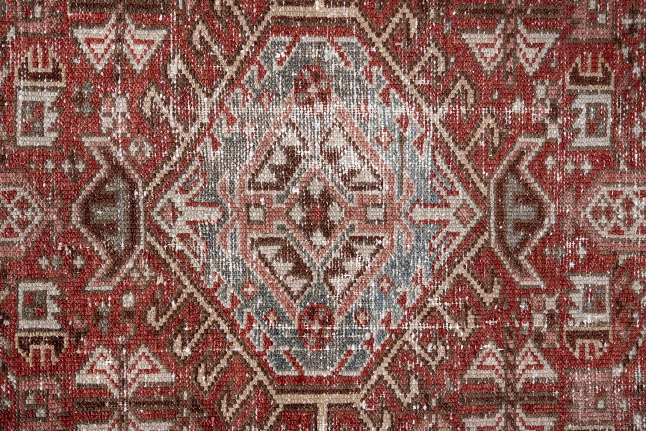 2' x 11' one-of-a-kind handmade antique Karaje runner rug. Color palette: rust, ivory, soft blue, terra cotta, brown, slate