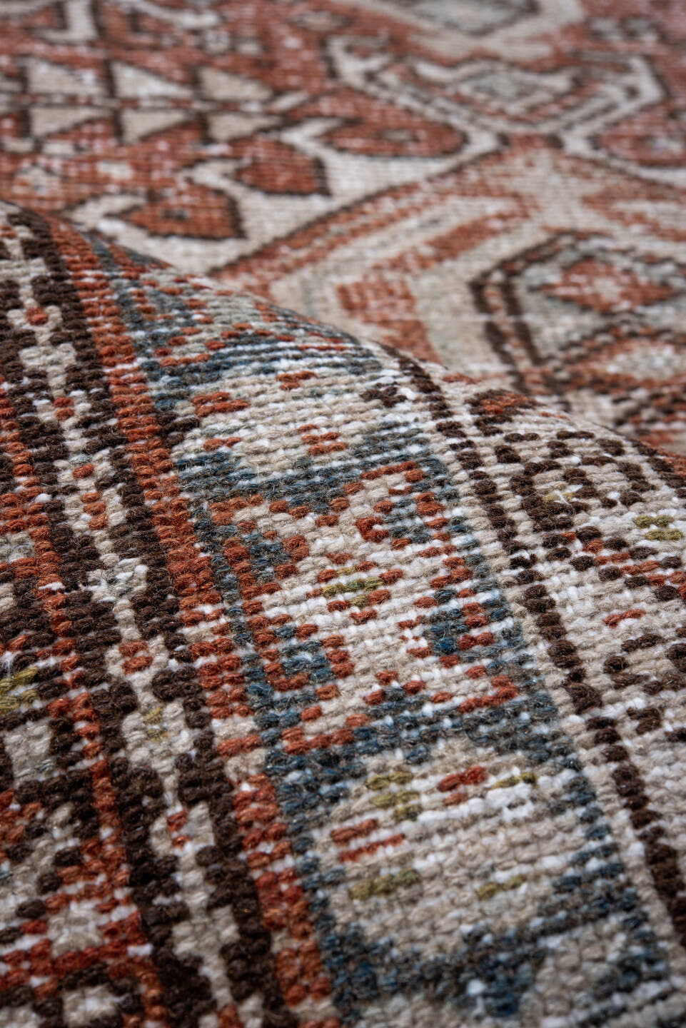 2' x 10' one-of-a-kind handmade antique Karaje runner rug. Color palette: rust, ivory, blue, brown, taupe, sage, terracotta