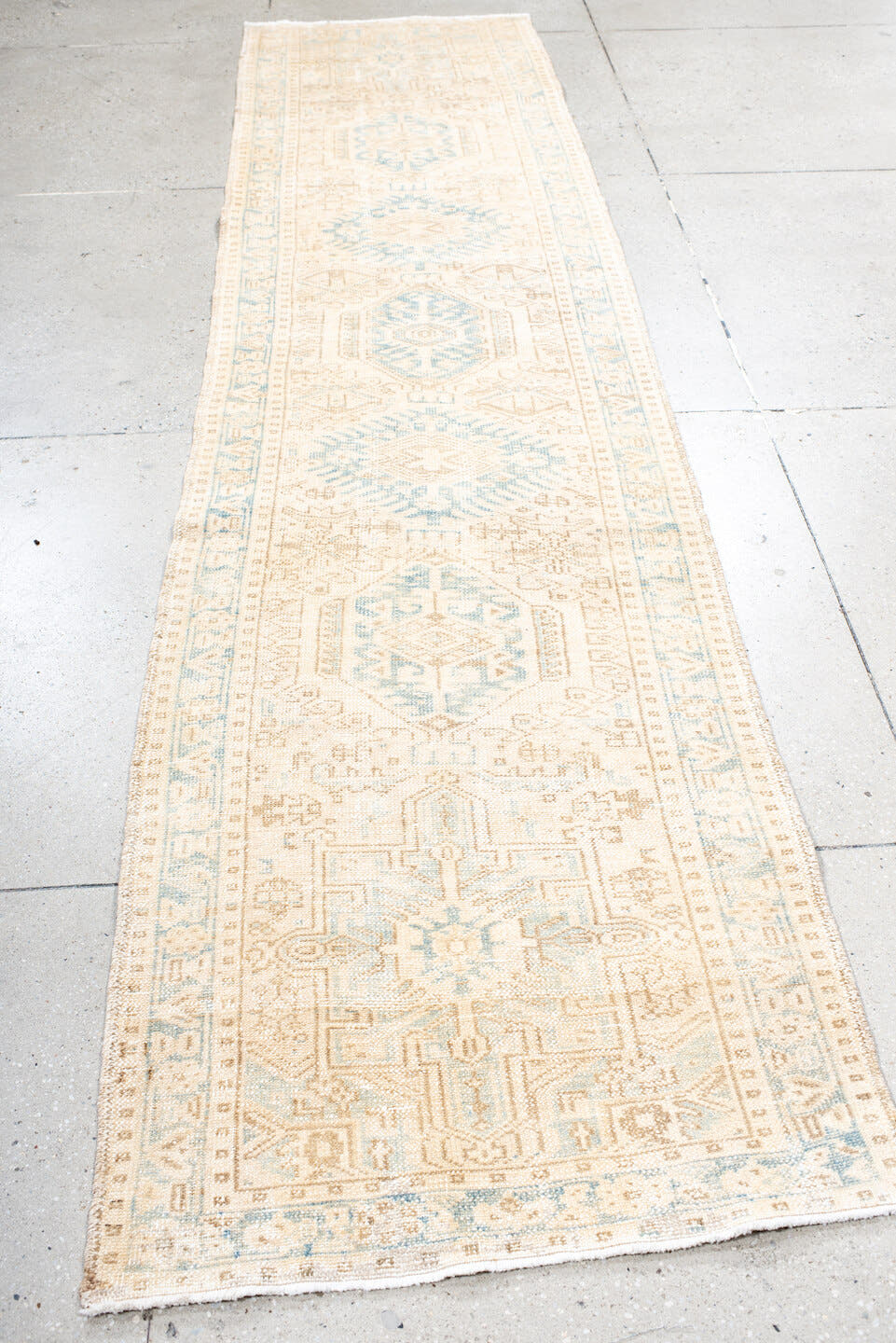2' x 11' one-of-a-kind handmade antique Karaje runner rug. Color palette: ivory, pale blue, beige, cream, taupe, light blue