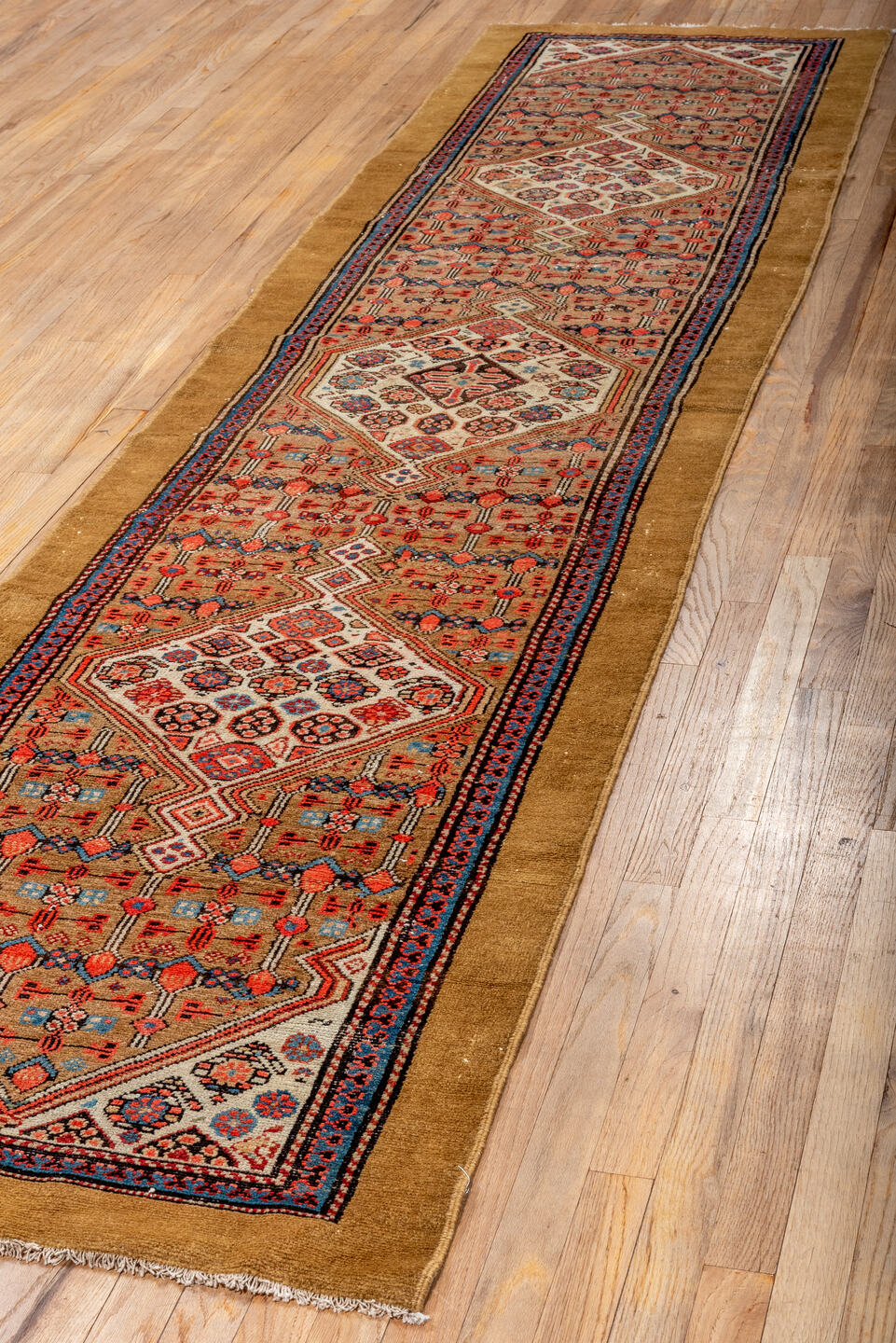 2' x 11' one-of-a-kind handmade antique Cam Hamadan runner rug. Color palette: camel, rust, ivory, indigo, blue, terracotta