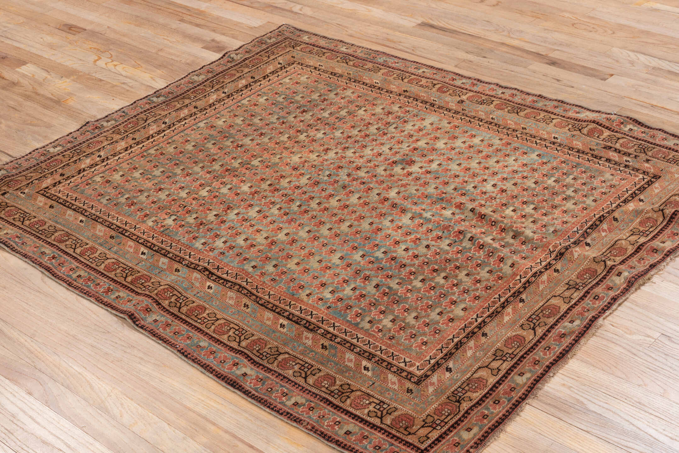 4' x 5' one-of-a-kind handmade antique Afshar small size rug. Color palette: camel, rust, ivory, charcoal, taupe, sage