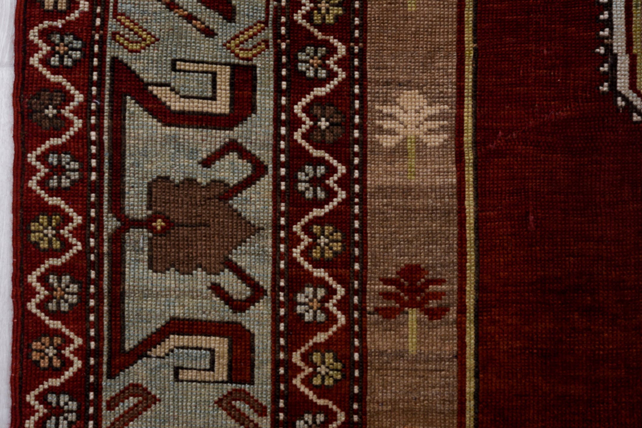 5' x 7' one-of-a-kind handmade antique Kazak rug. Color palette: red, ivory, sky blue, burgundy, taupe, brown, light blue