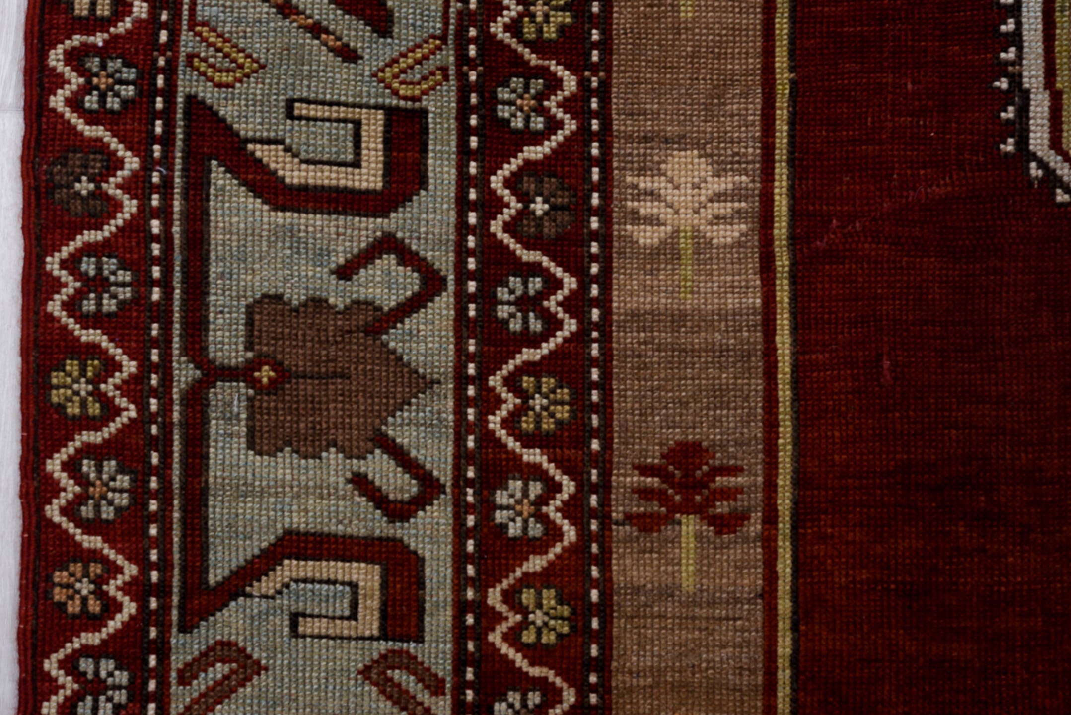 5' x 7' one-of-a-kind handmade antique Kazak rug. Color palette: red, ivory, sky blue, burgundy, taupe, brown, light blue