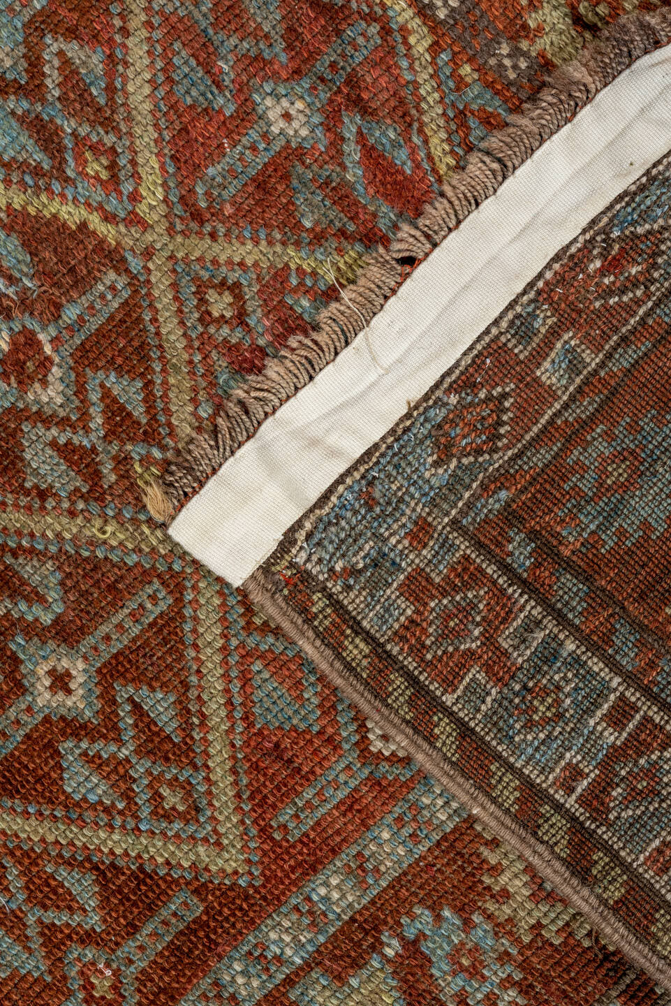 4' x 8' one-of-a-kind handmade antique Kurd rug. Color palette: rust, camel, ivory, sky blue, brown, taupe, gold, terracotta