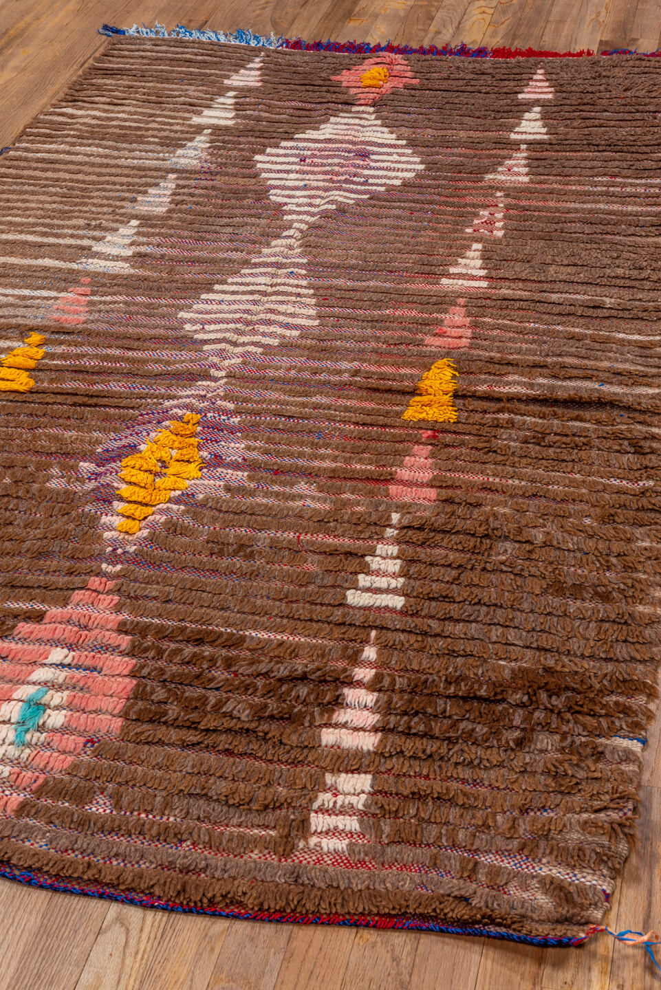 3' x 7' one-of-a-kind handmade vintage Moroccan rug. Color palette: blue, brown, gray, light gray, off-white, orange, pink