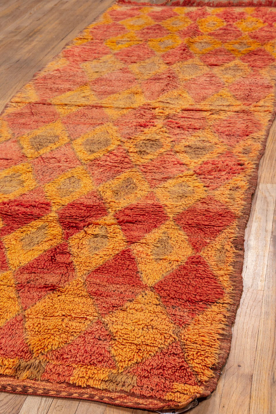3' x 10' one-of-a-kind handmade vintage Moroccan runner rug. Color palette: coral, saffron, terra cotta, taupe, rose, camel