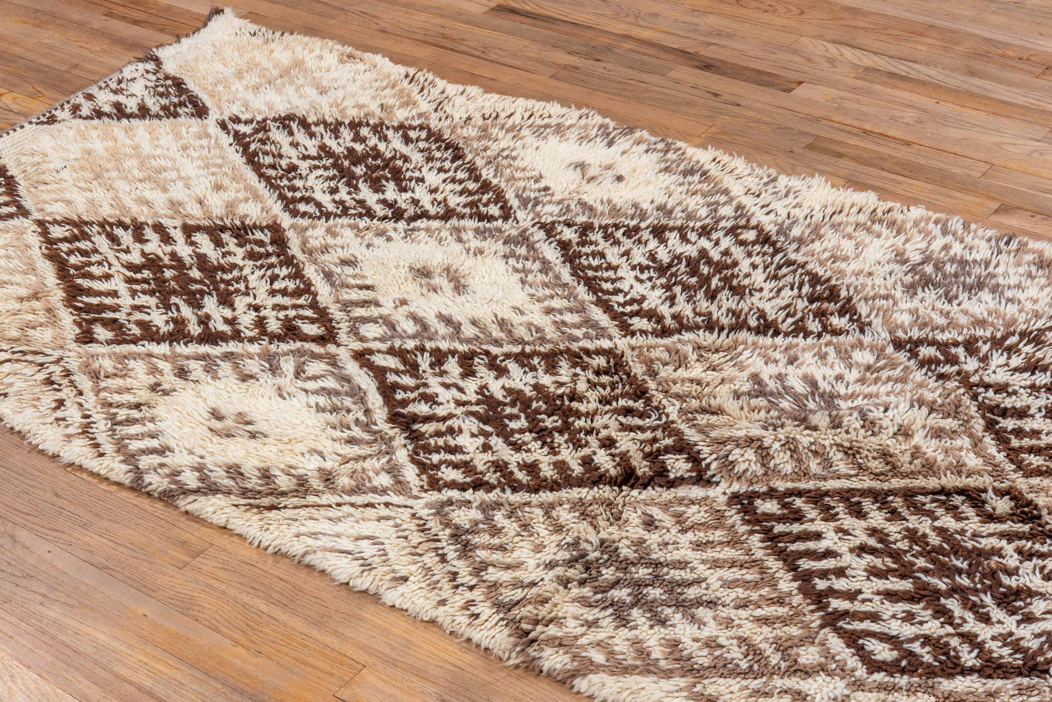 3' x 7' one-of-a-kind handmade vintage Moroccan rug. Color palette: black, brown, gray, light gray, off-white, pink