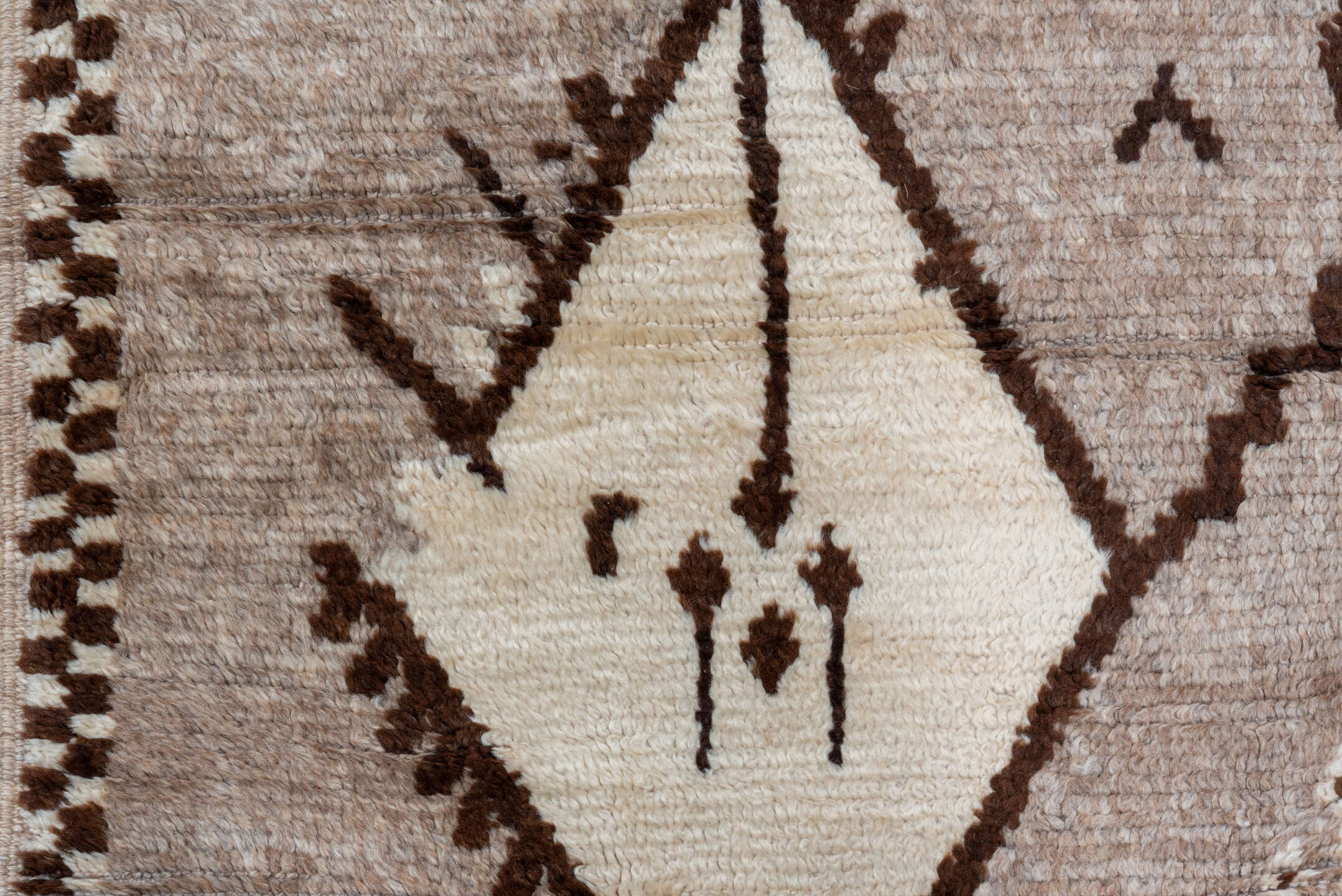 4' x 9' one-of-a-kind handmade vintage Moroccan runner rug. Color palette: black, brown, gray, light gray, off-white, orange