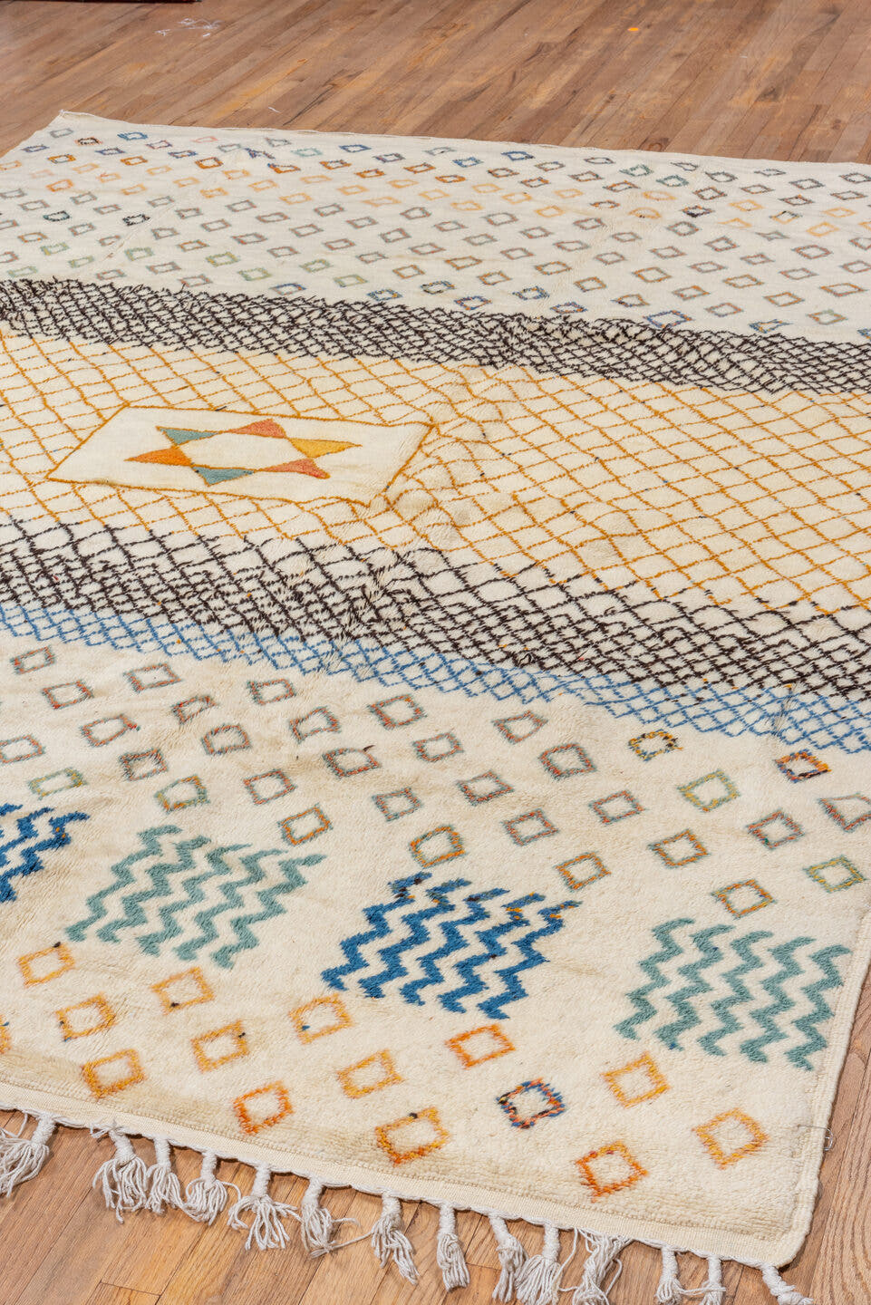 7' x 10' one-of-a-kind handmade vintage Moroccan large size rug. Color palette: ivory, gold, charcoal, sky_blue, teal