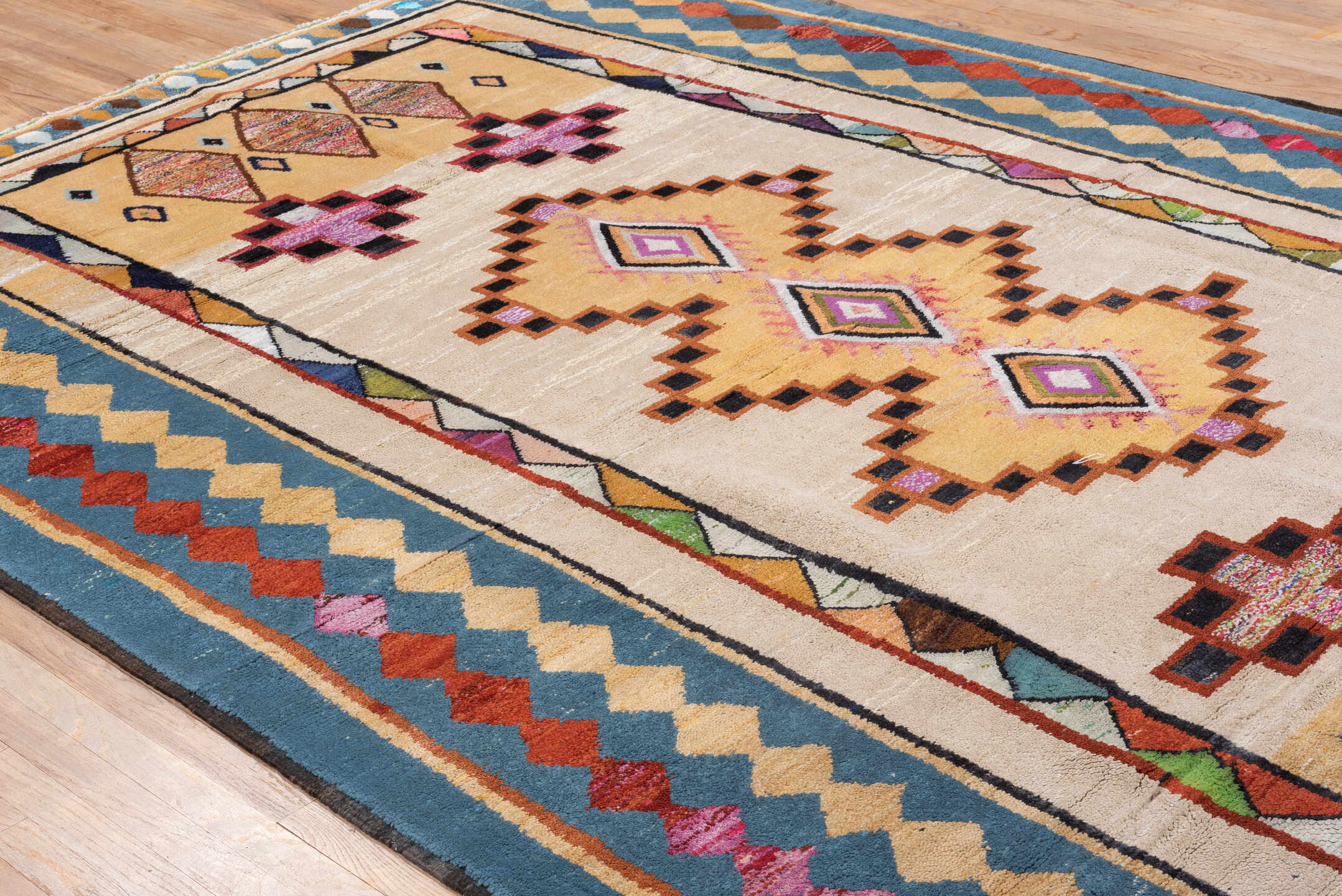 7' x 12' one-of-a-kind handmade vintage Moroccan large size rug. Color palette: ivory, blue, camel, crimson, pink, black