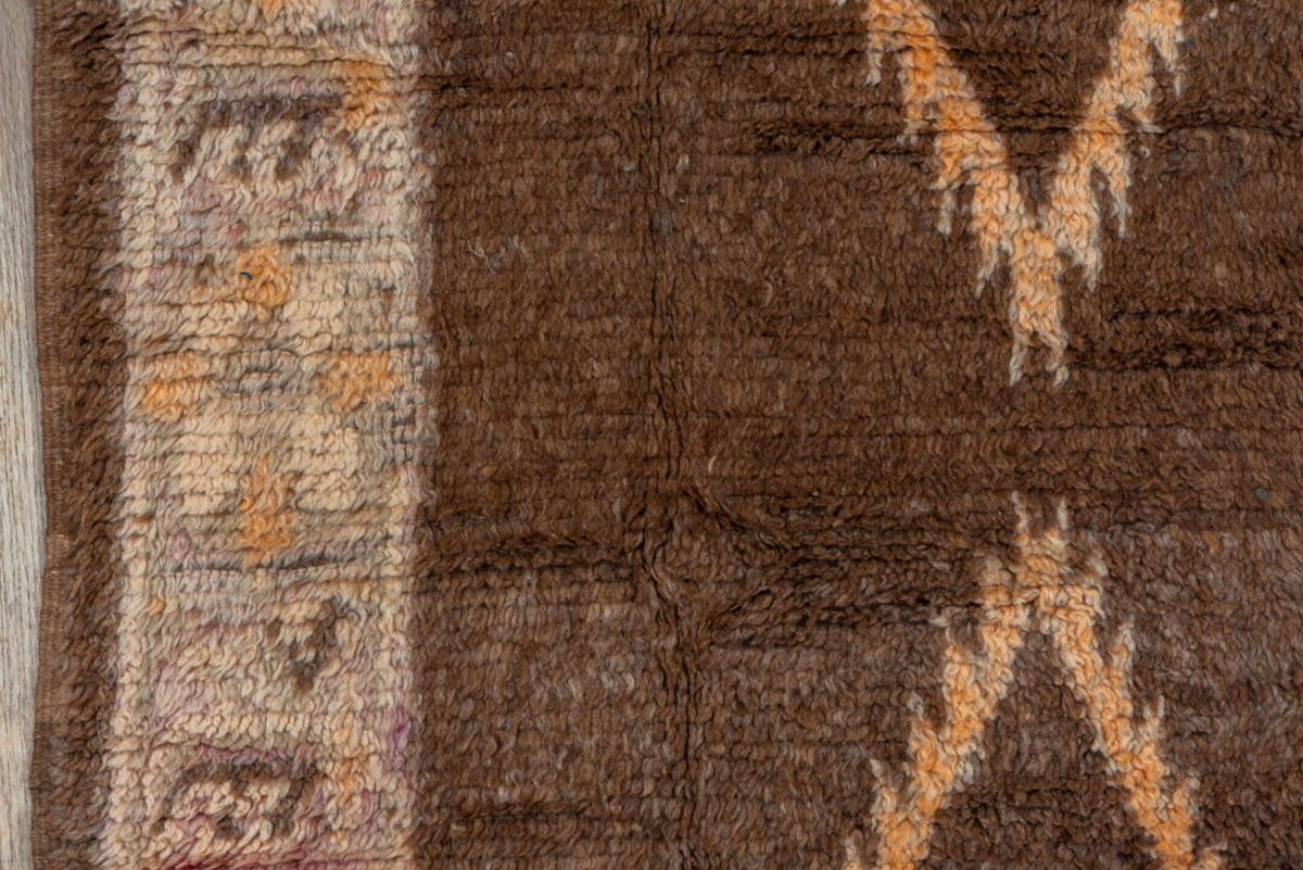 4' x 7' one-of-a-kind handmade vintage Moroccan rug. Color palette: brown, ivory, blush, taupe, charcoal, teal, purple, gold
