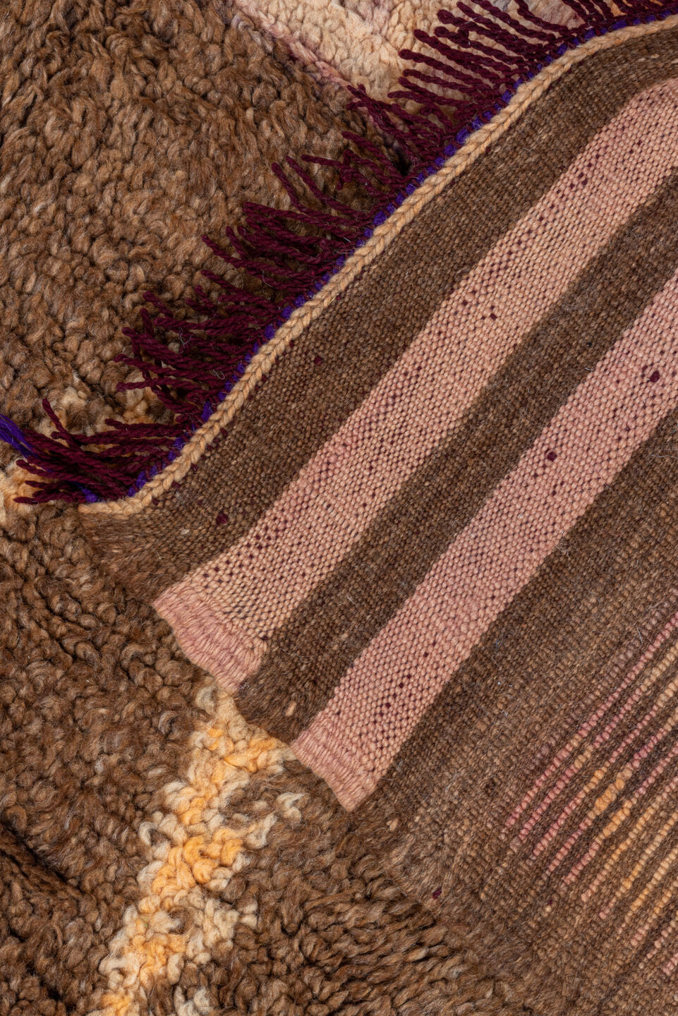 4' x 7' one-of-a-kind handmade vintage Moroccan rug. Color palette: brown, ivory, blush, taupe, charcoal, teal, purple, gold