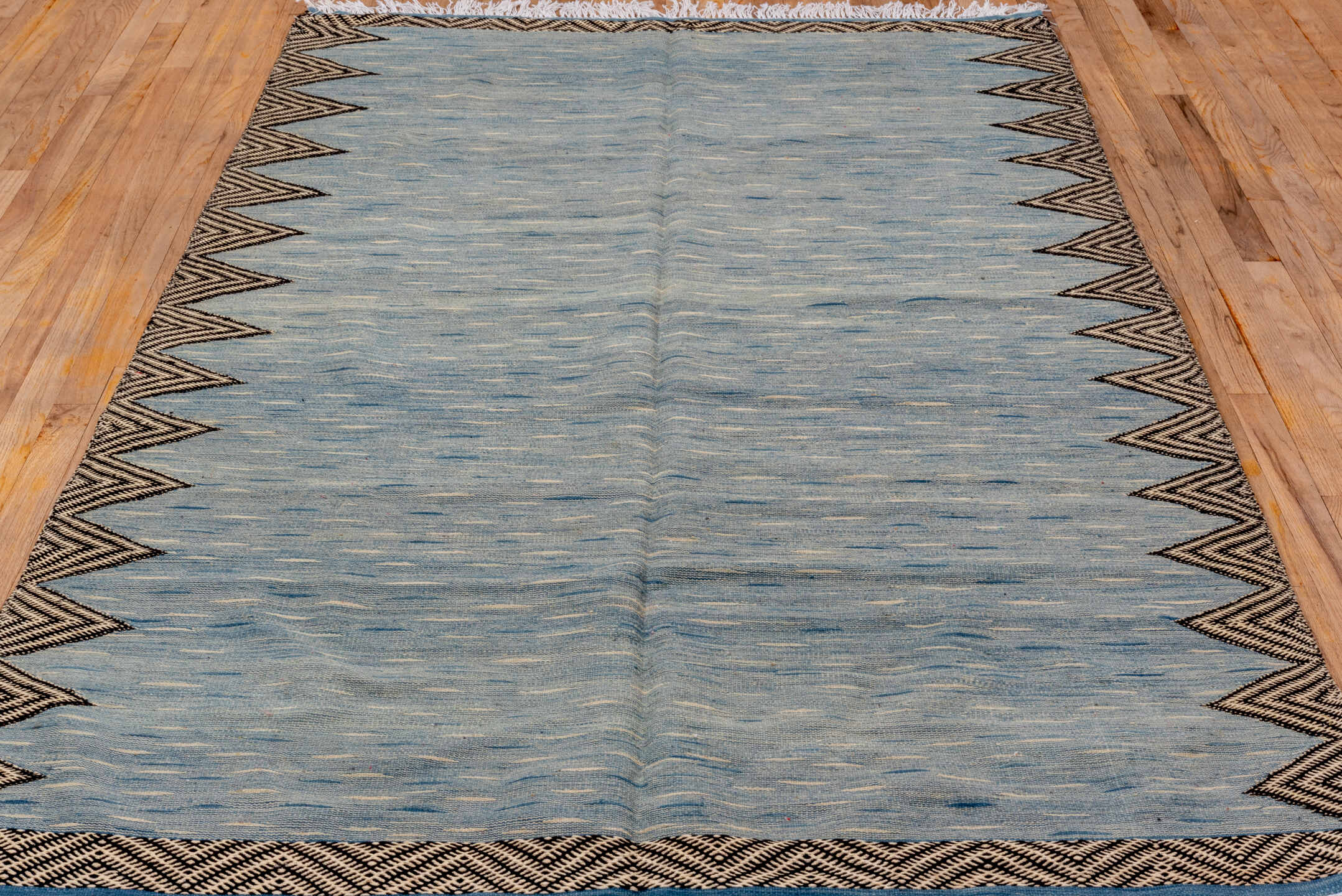 4' x 8' one-of-a-kind handmade vintage Kilim rug. Color palette: pale blue, ivory, charcoal, slate, light blue, gray, black