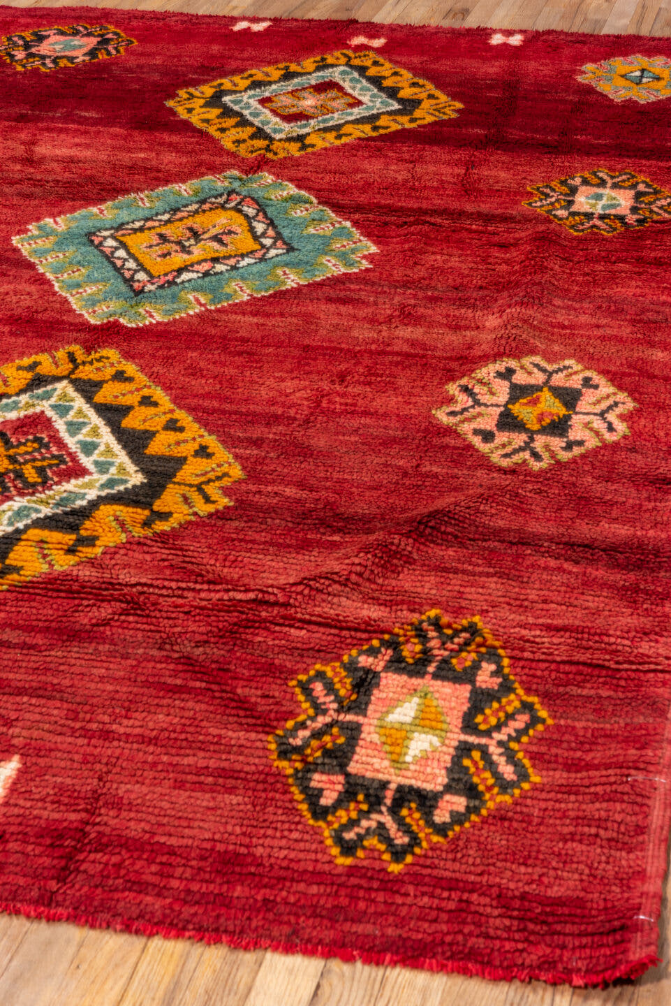 6' x 9' one-of-a-kind handmade antique Moroccan medium size rug. Color palette: red, rust, gold, pink, sage, ivory, charcoal