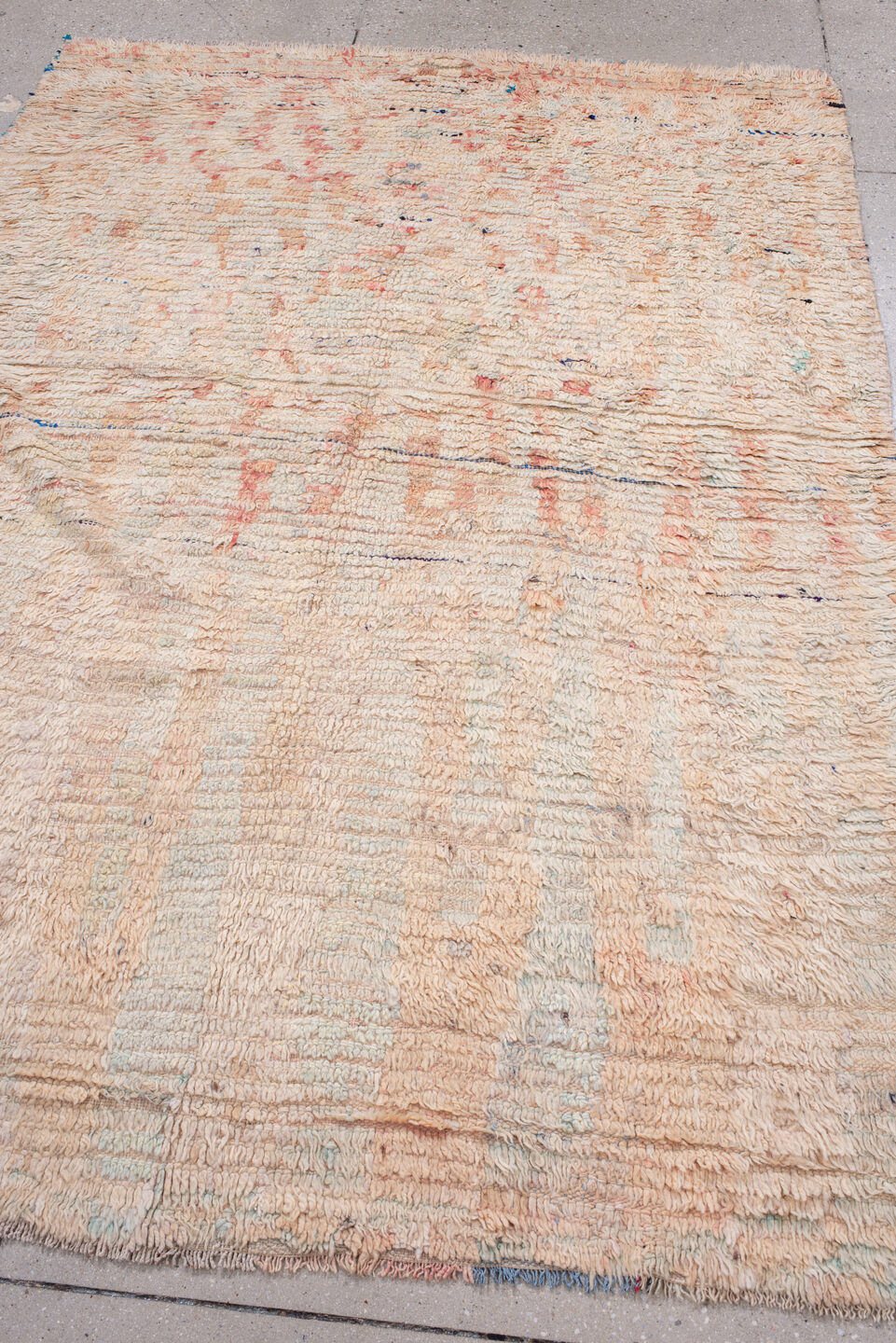 5' x 7' one-of-a-kind handmade antique Moroccan rug. Color palette: ivory, blush, peach, pale blue, cream, charcoal, pink