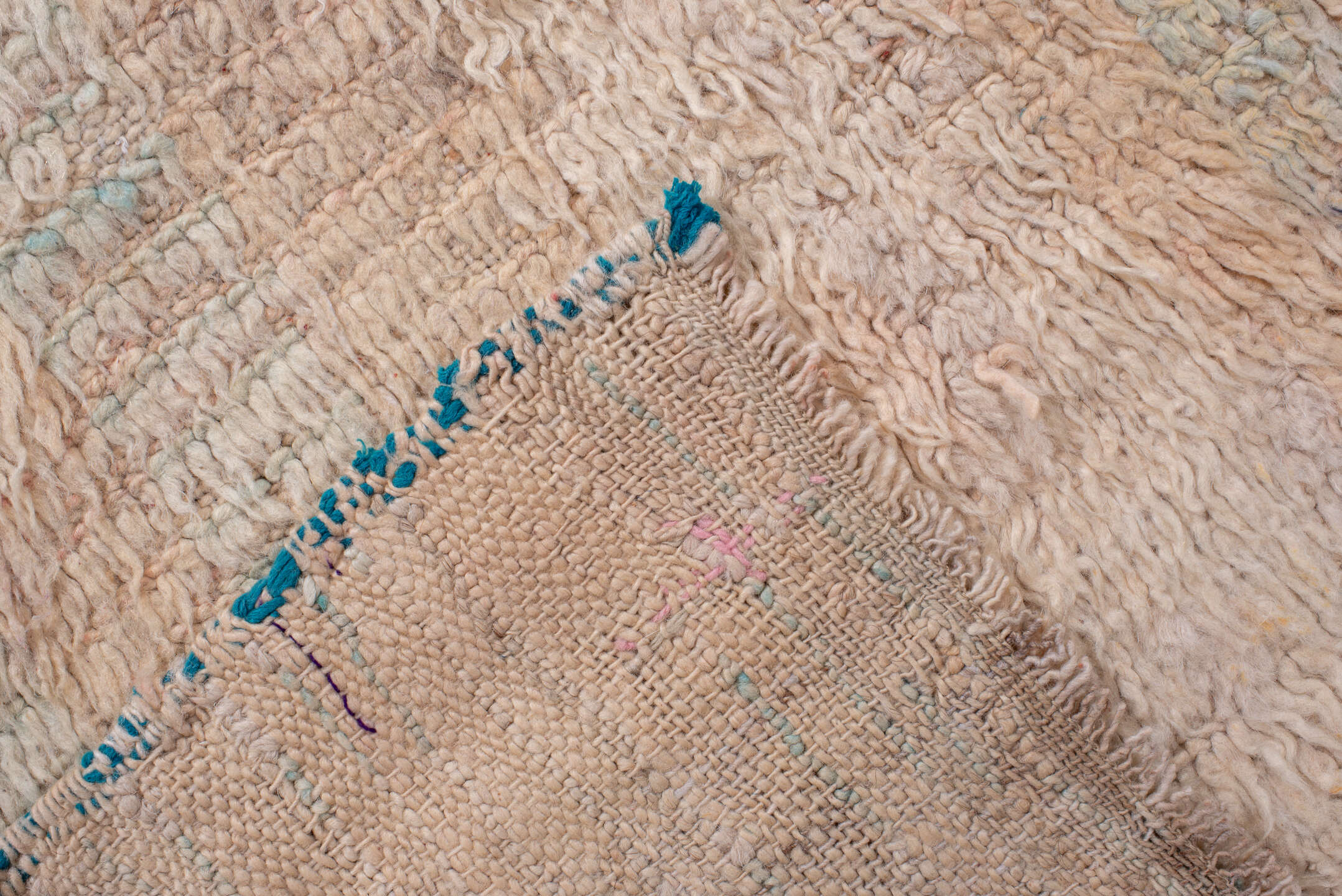 5' x 7' one-of-a-kind handmade antique Moroccan rug. Color palette: ivory, blush, peach, pale blue, cream, charcoal, pink