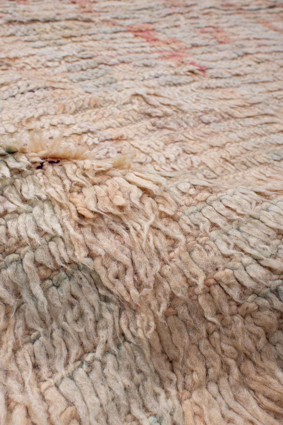 5' x 7' one-of-a-kind handmade antique Moroccan rug. Color palette: ivory, blush, peach, pale blue, cream, charcoal, pink