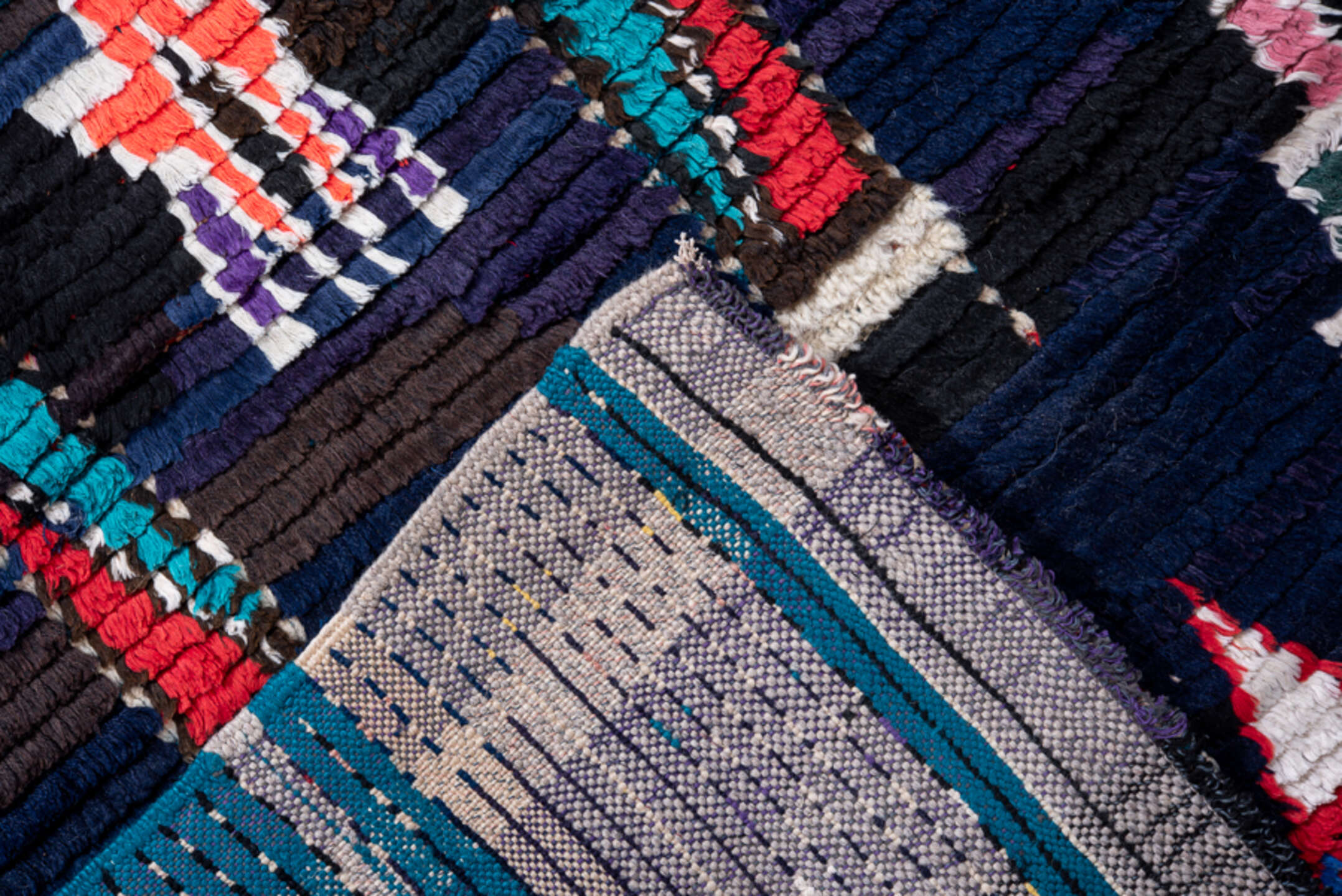 3' x 7' one-of-a-kind handmade vintage Moroccan runner rug. Color palette: navy, black, turquoise, coral, ivory, violet