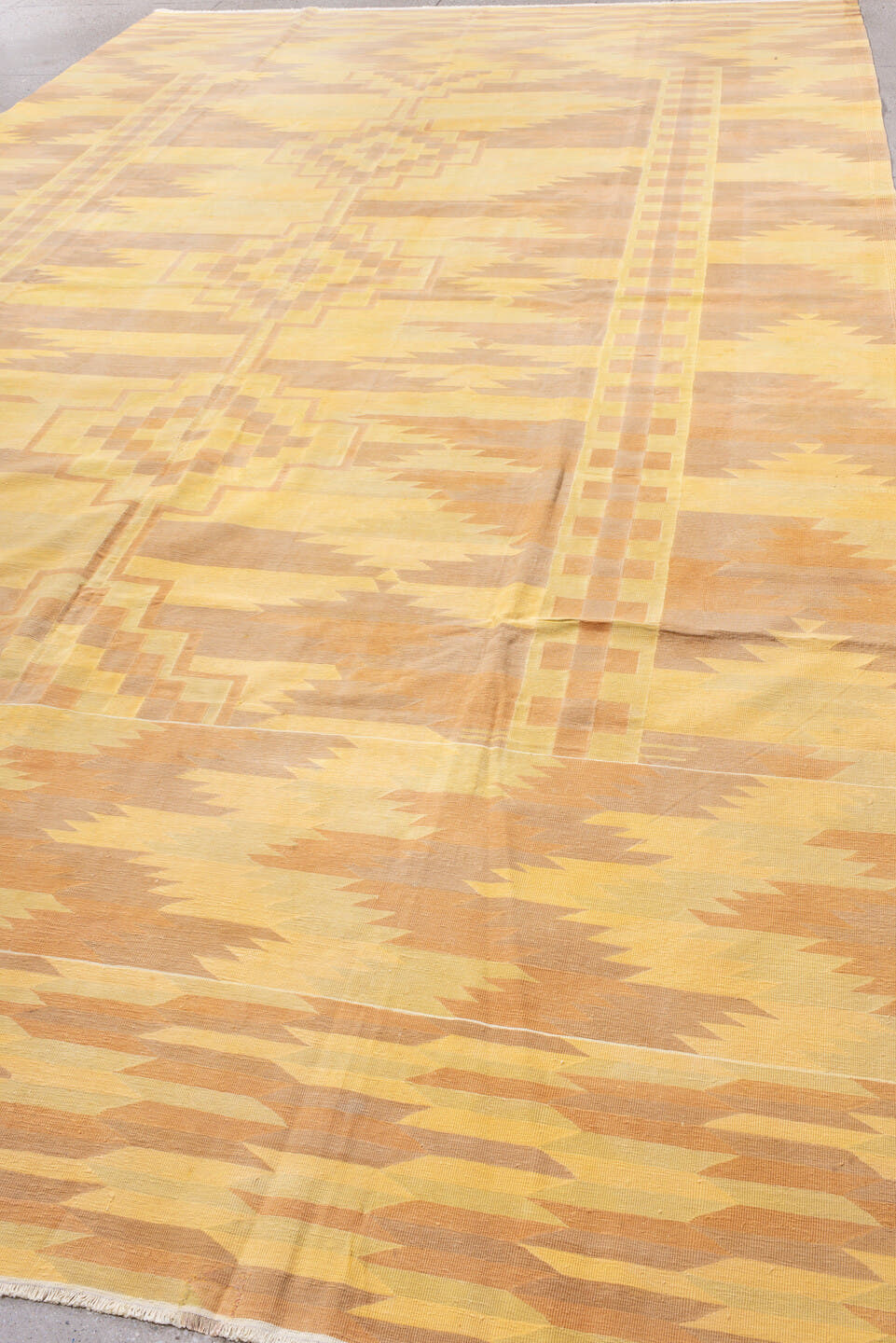 9' x 16' one-of-a-kind handmade antique Dhurrie rug. Color palette: gold, butter yellow, peach, terra cotta, camel