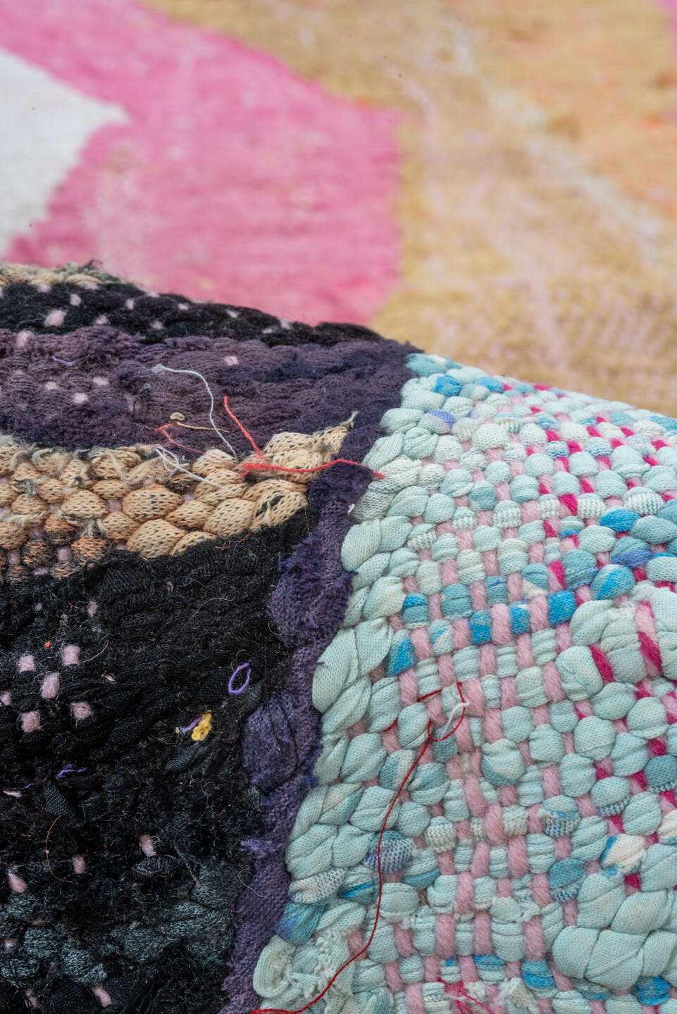 4' x 8' one-of-a-kind handmade vintage Rag Rug rug. Color palette: ivory, pink, tan, charcoal, sky_blue, taupe, orange