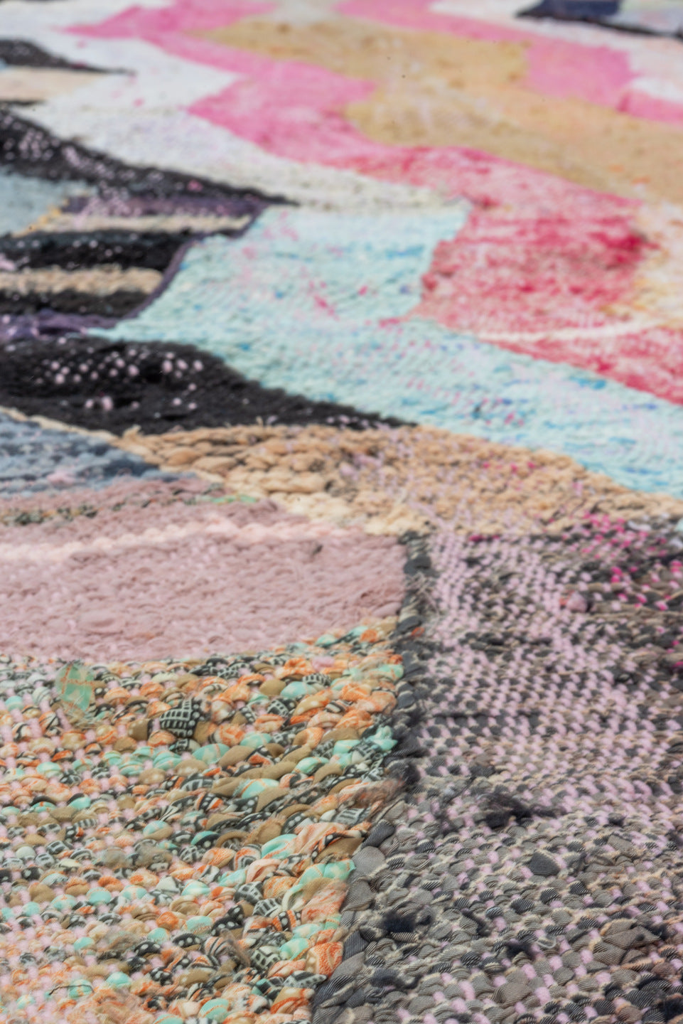 4' x 8' one-of-a-kind handmade vintage Rag Rug rug. Color palette: ivory, pink, tan, charcoal, sky_blue, taupe, orange