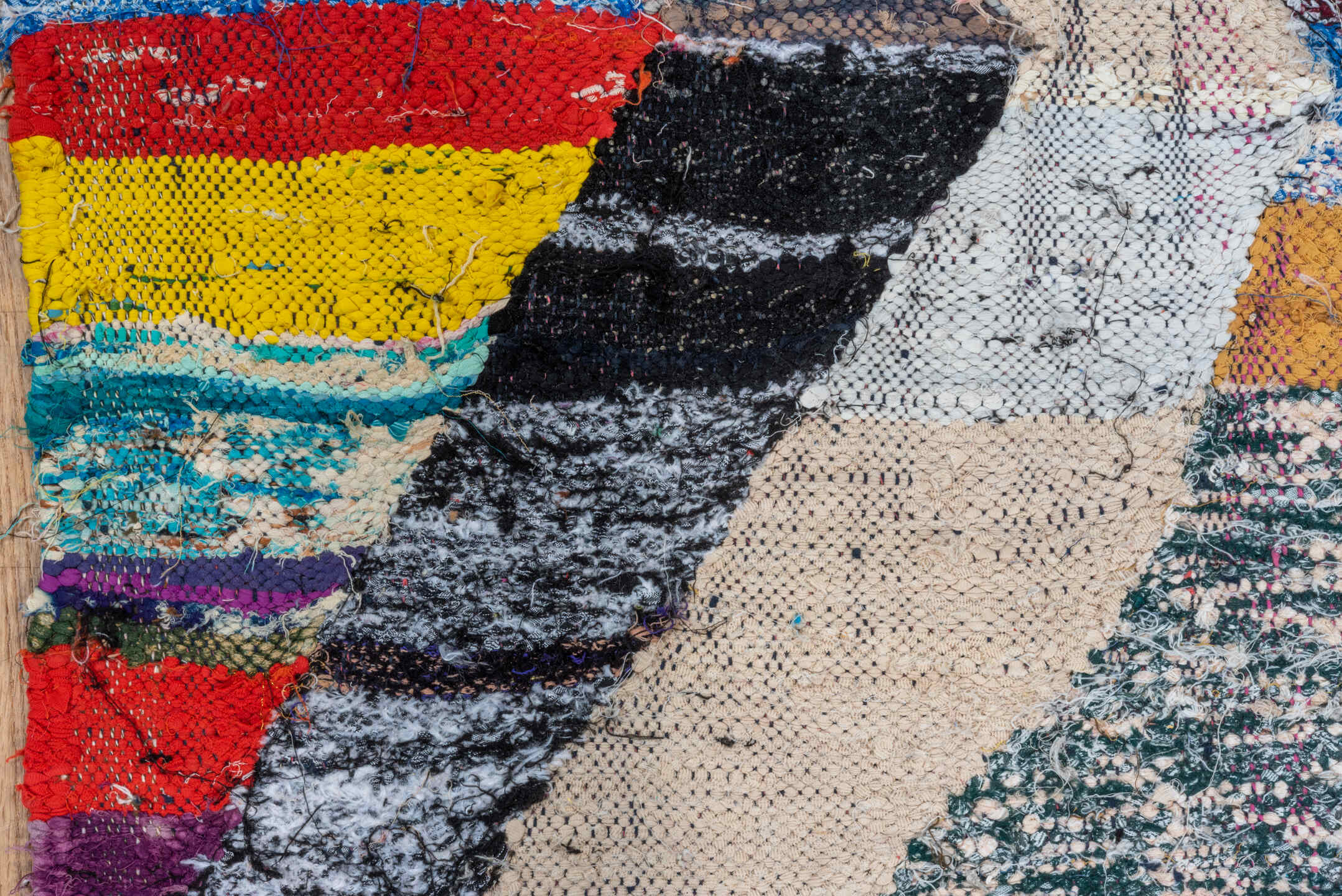 4' x 8' one-of-a-kind handmade vintage Rag Rug runner rug. Color palette: ivory, black, sky_blue, pink, yellow, rust, brown