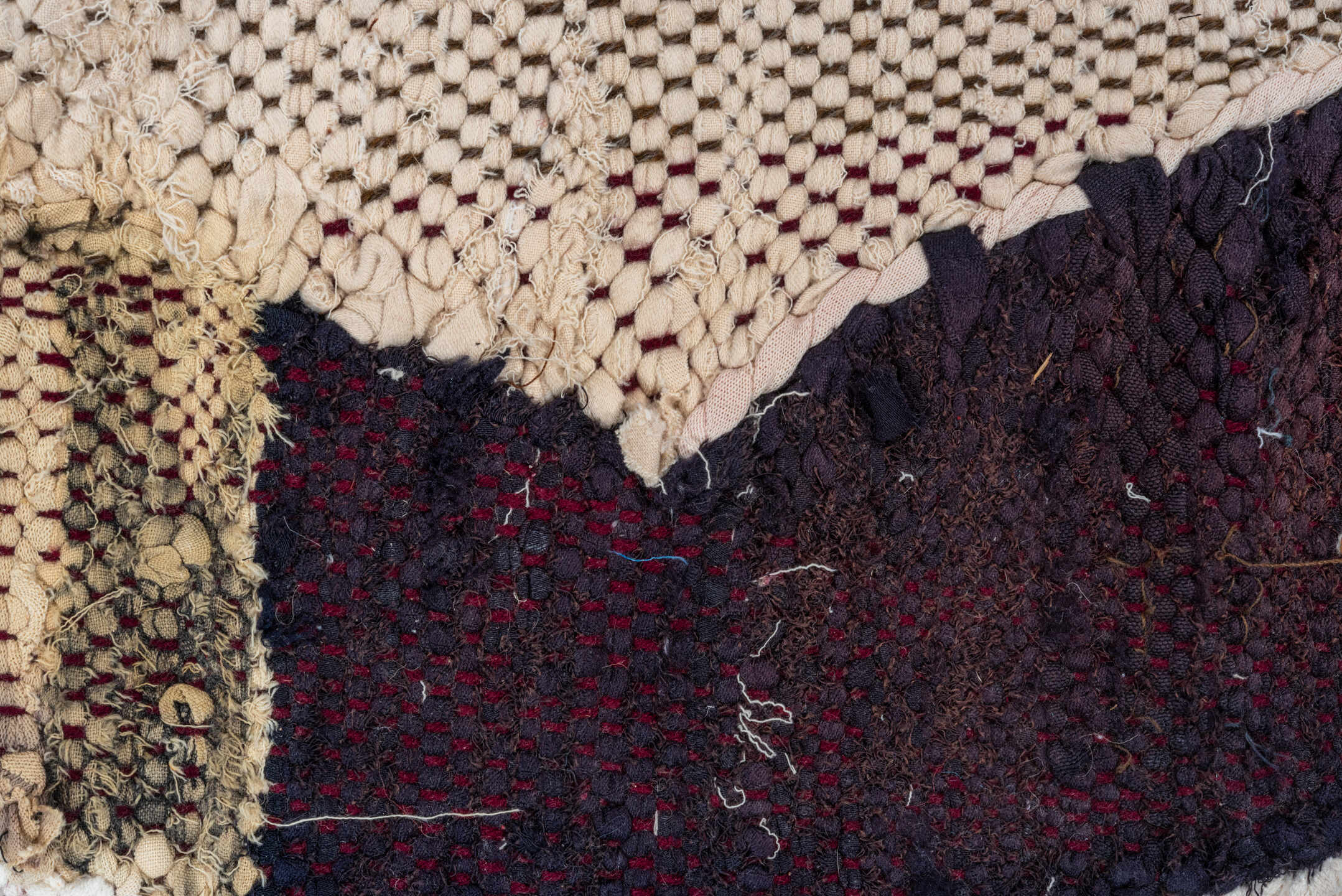 4' x 8' one-of-a-kind handmade vintage Rag Rug rug. Color palette: ivory, charcoal, plum, crimson, lavender, sky blue, brown