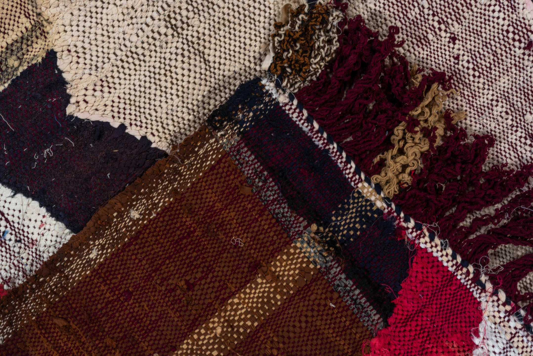 4' x 8' one-of-a-kind handmade vintage Rag Rug rug. Color palette: ivory, charcoal, plum, crimson, lavender, sky blue, brown