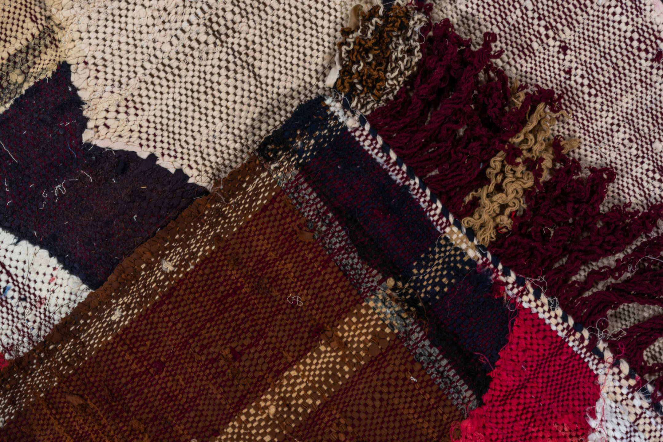 4' x 8' one-of-a-kind handmade vintage Rag Rug rug. Color palette: ivory, charcoal, plum, crimson, lavender, sky blue, brown