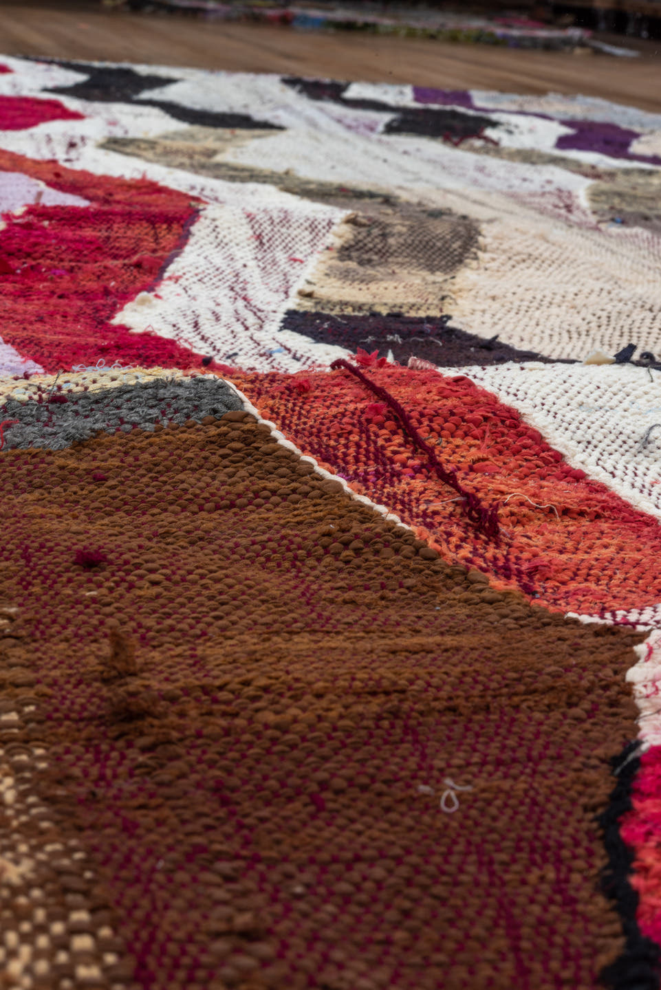 4' x 8' one-of-a-kind handmade vintage Rag Rug rug. Color palette: ivory, charcoal, plum, crimson, lavender, sky blue, brown