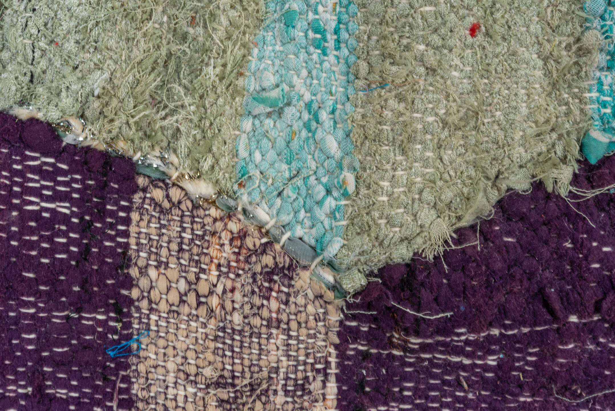 4' x 8' one-of-a-kind handmade vintage Rag Rug rug. Color palette: blue, brown, gray, light gray, off-white, pink, red