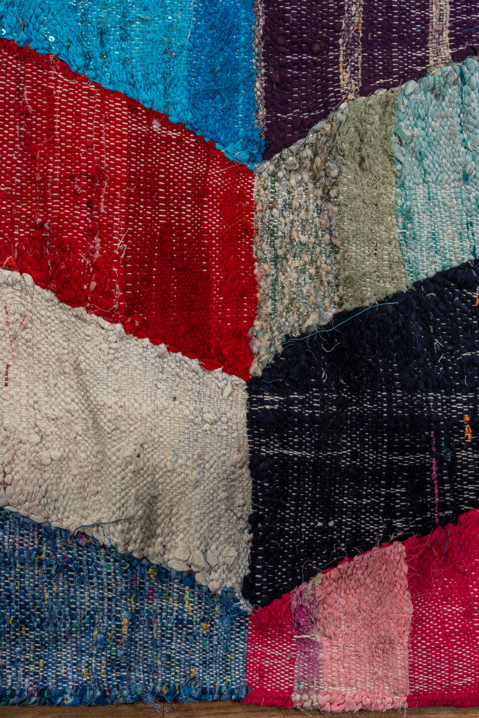 4' x 8' one-of-a-kind handmade vintage Rag Rug rug. Color palette: ivory, turquoise, navy, coral, plum, pink, orange, gray