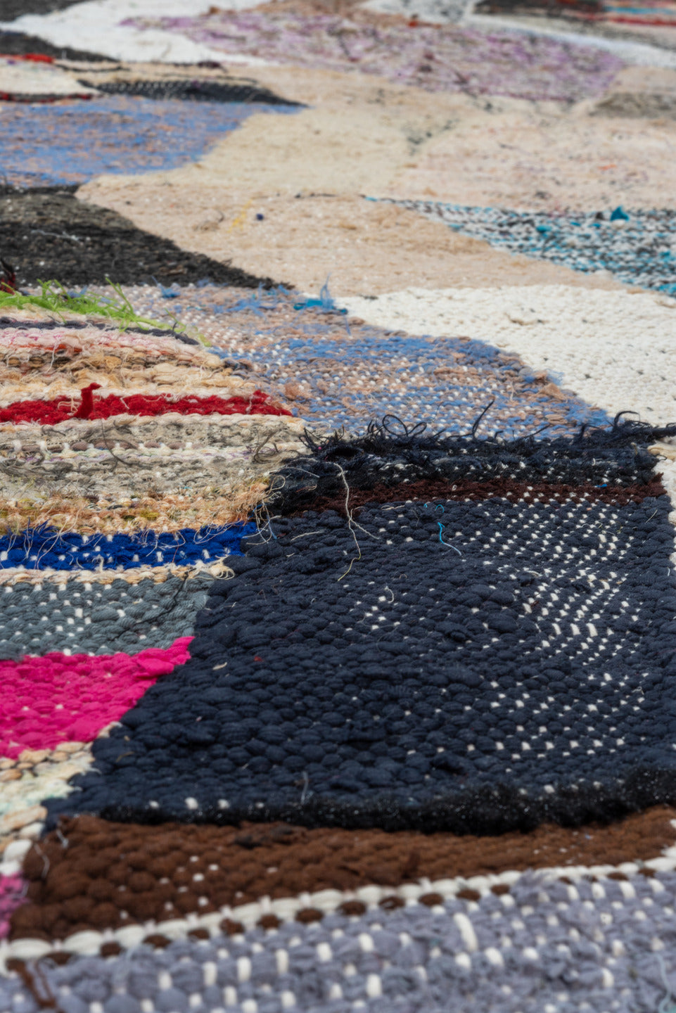 4' x 8' one-of-a-kind handmade vintage Rag Rug rug. Color palette: black, blue, brown, gainsboro, gray, light gray