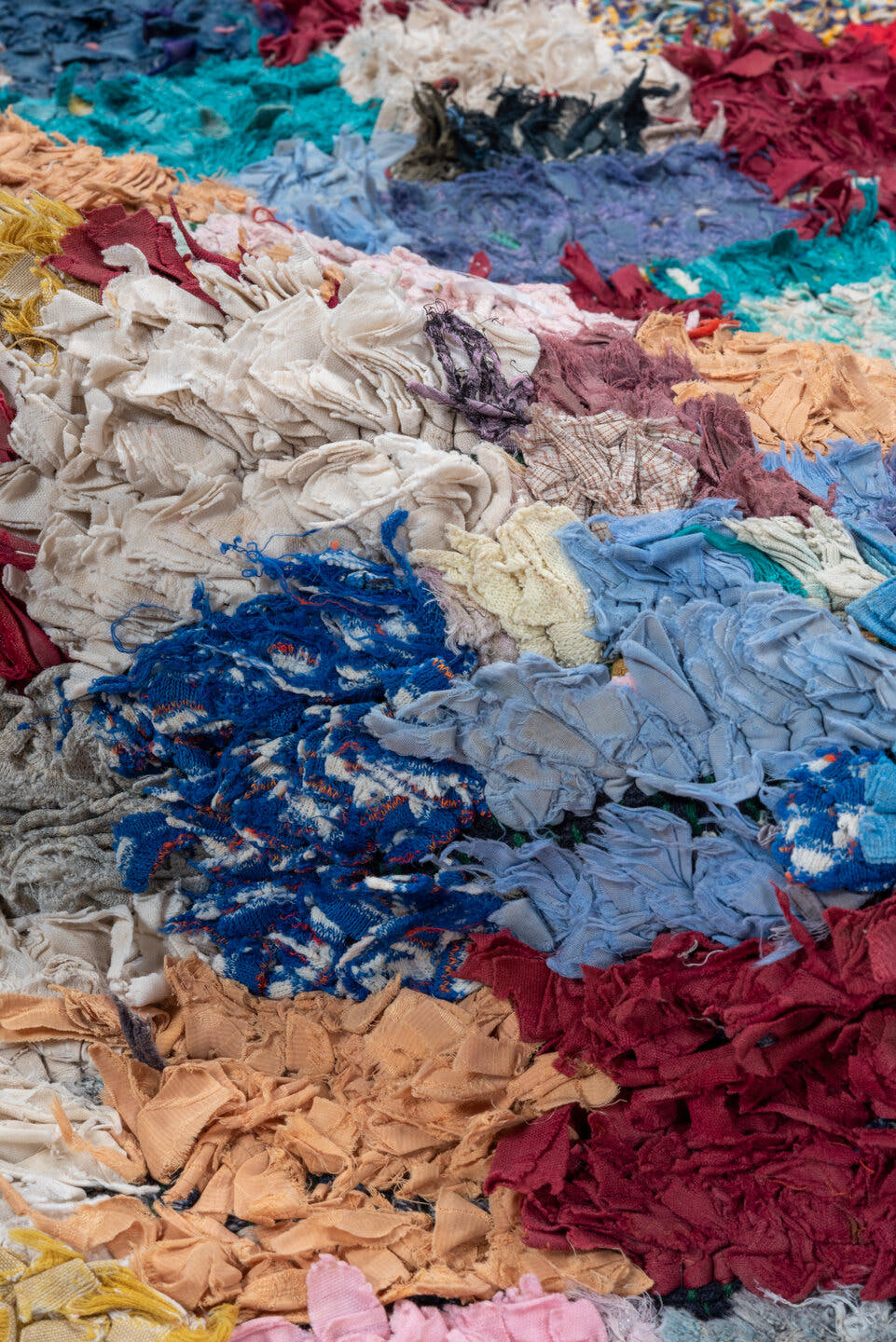3' x 7' one-of-a-kind handmade vintage Rag Rug runner rug. Color palette: ivory, blush, denim, crimson, lavender, sky_blue