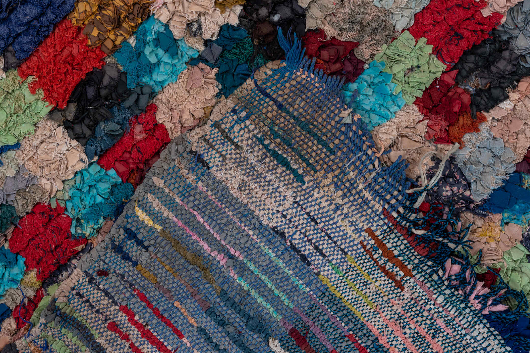 4' x 6' one-of-a-kind handmade vintage Rag Rug small size rug. Color palette: black, blue, brown, cadet blue, fire brick
