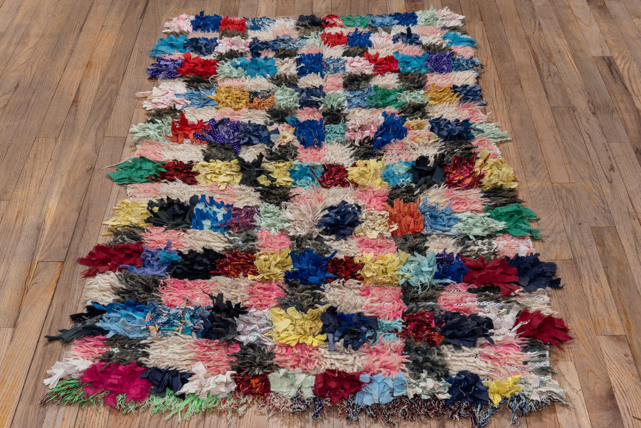 3' x 5' one-of-a-kind handmade vintage Rag Rug small size rug. Color palette: ivory, blush, cobalt, charcoal, crimson