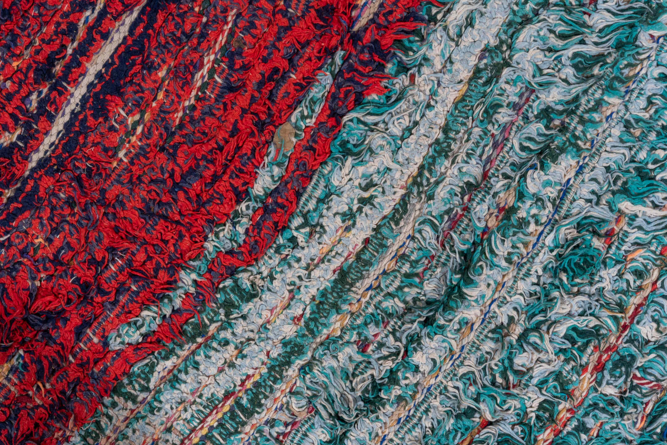 3' x 8' one-of-a-kind handmade vintage Rag Rug runner rug. Color palette: crimson, ivory, red, aqua, navy, rose, teal, blue