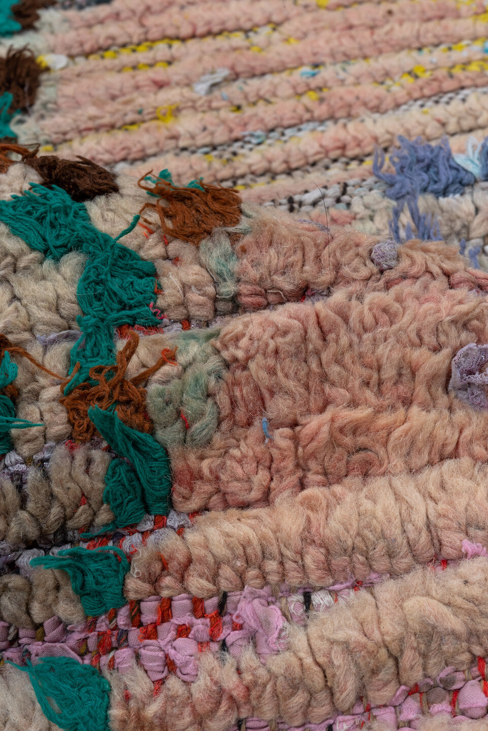 2' x 6' one-of-a-kind handmade vintage Rag Rug runner rug. Color palette: blue, brown, gray, green, pink, redwood