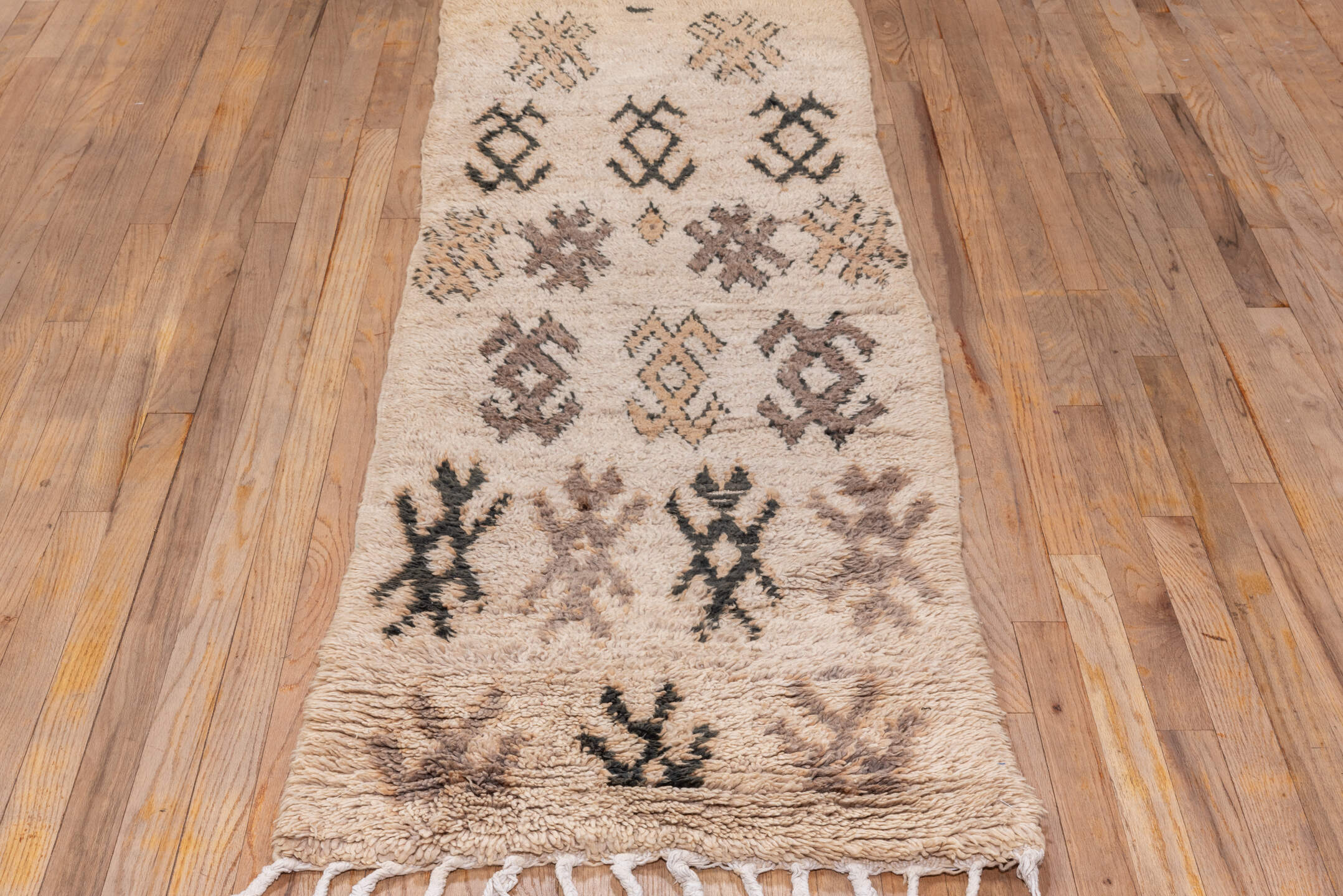 2' x 7' one-of-a-kind handmade vintage Moroccan runner rug. Color palette: black, brown, gray, light gray, off-white, pink