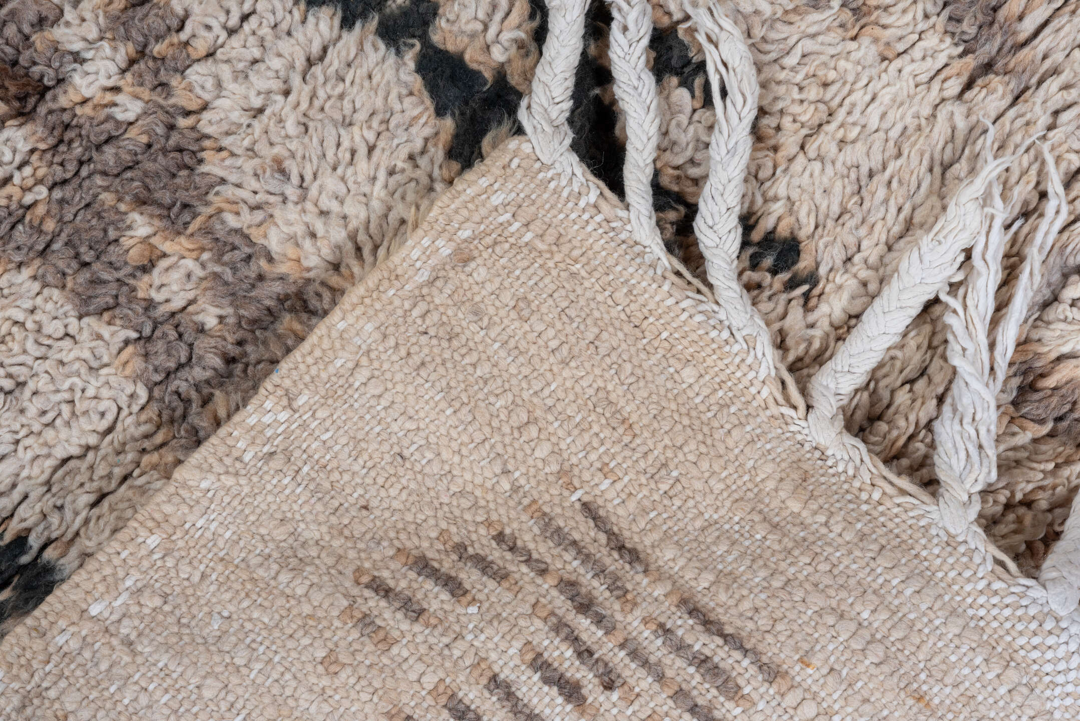 2' x 7' one-of-a-kind handmade vintage Moroccan runner rug. Color palette: black, brown, gray, light gray, off-white, pink