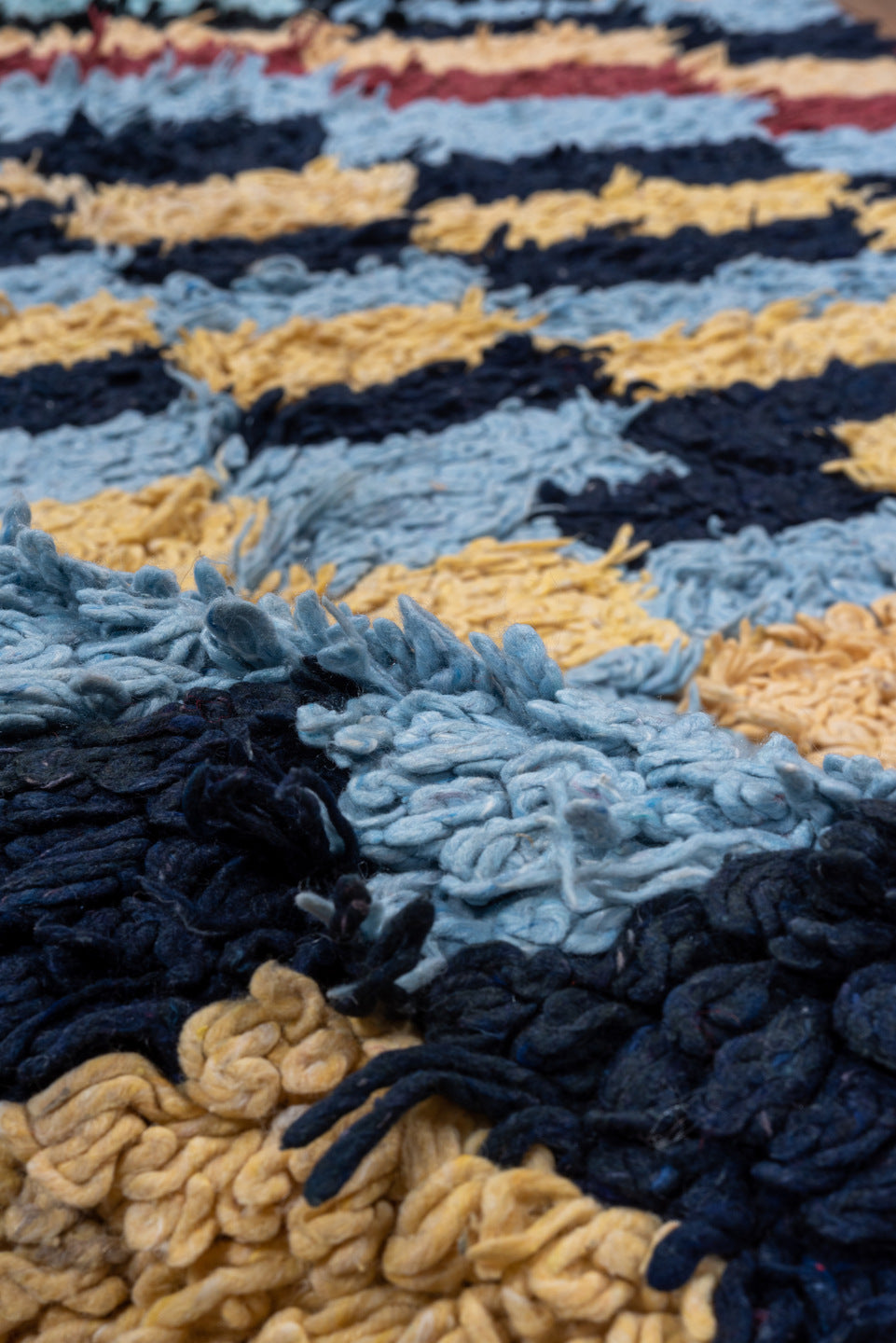 3' x 6' one-of-a-kind handmade vintage Rag Rug runner rug. Color palette: light blue, cream, navy, teal, rust, black, ivory