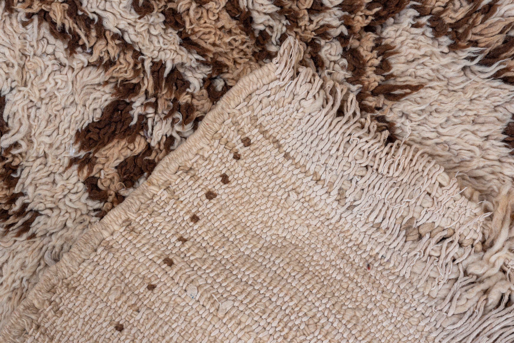 2' x 4' one-of-a-kind handmade vintage Moroccan small size rug. Color palette: ivory, camel, brown, beige
