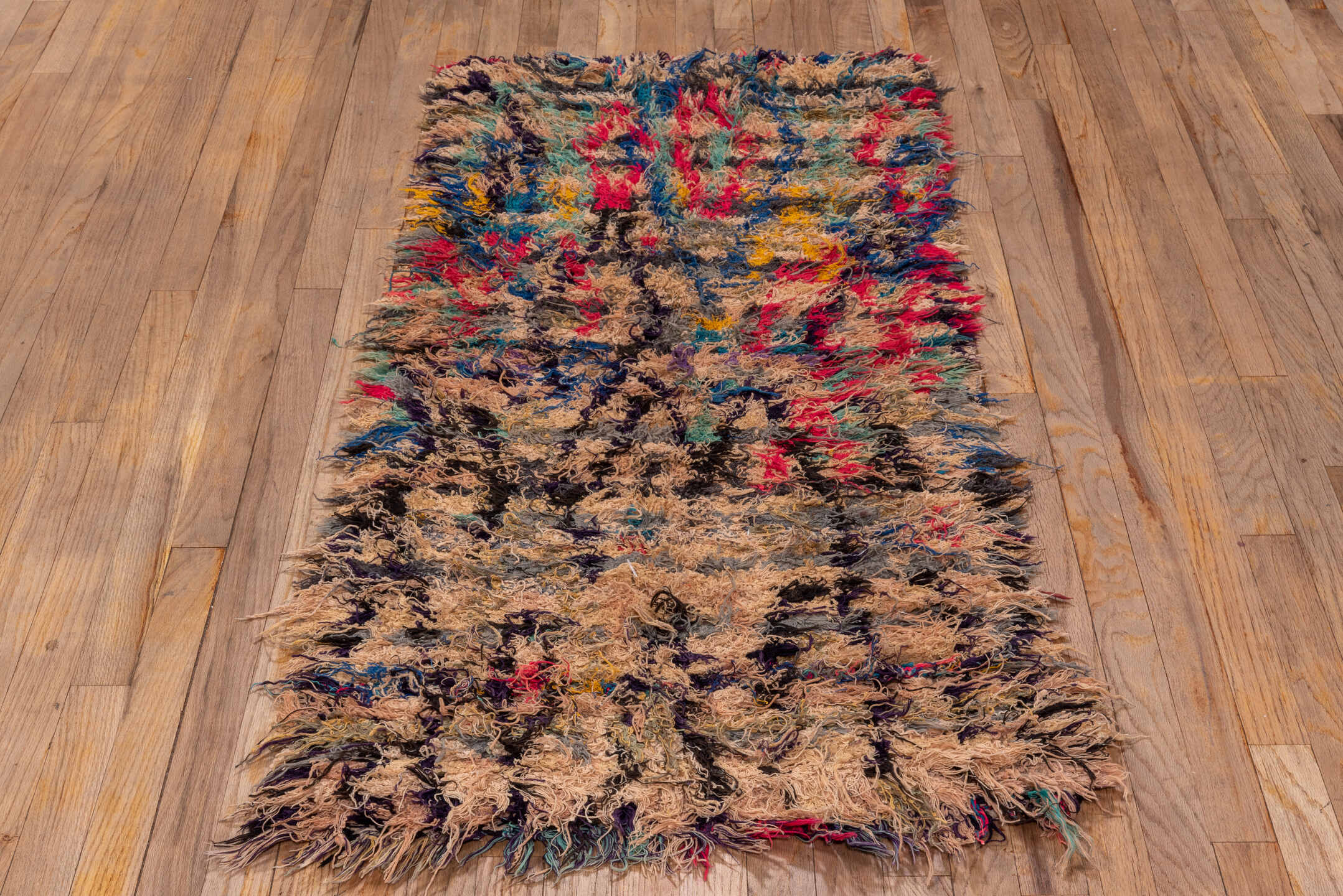 2' x 5' one-of-a-kind handmade vintage Rag Rug small size rug. Color palette: tan, charcoal, crimson, cobalt, turquoise