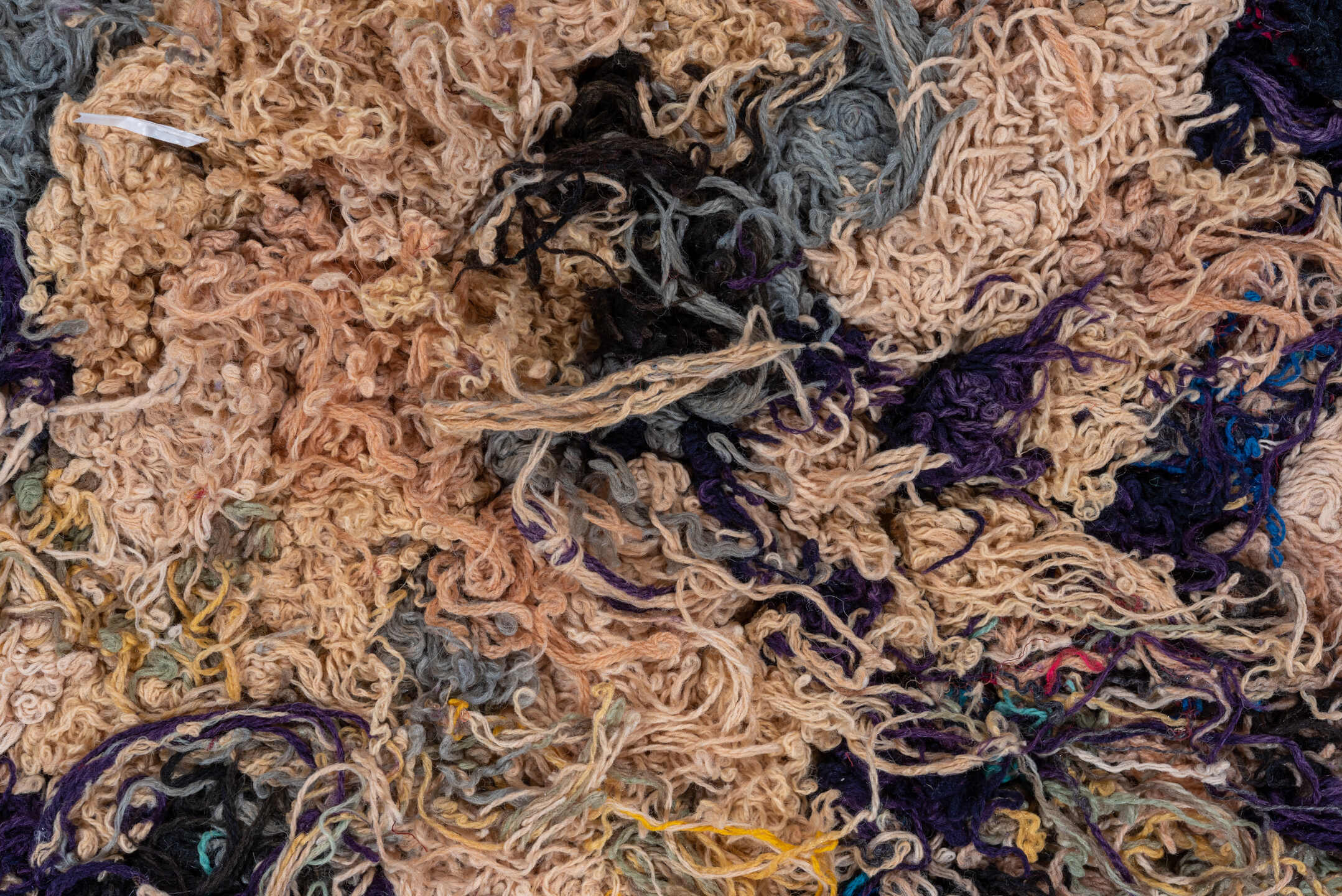2' x 5' one-of-a-kind handmade vintage Rag Rug small size rug. Color palette: tan, charcoal, crimson, cobalt, turquoise