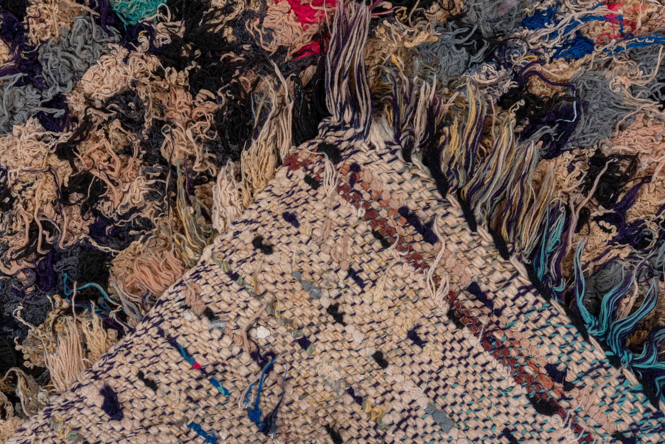 2' x 5' one-of-a-kind handmade vintage Rag Rug small size rug. Color palette: tan, charcoal, crimson, cobalt, turquoise