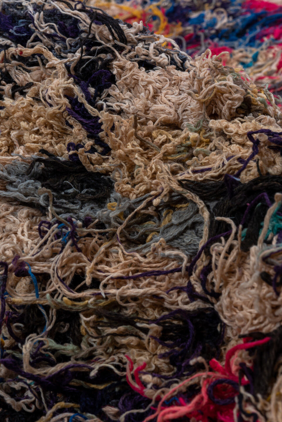 2' x 5' one-of-a-kind handmade vintage Rag Rug small size rug. Color palette: tan, charcoal, crimson, cobalt, turquoise