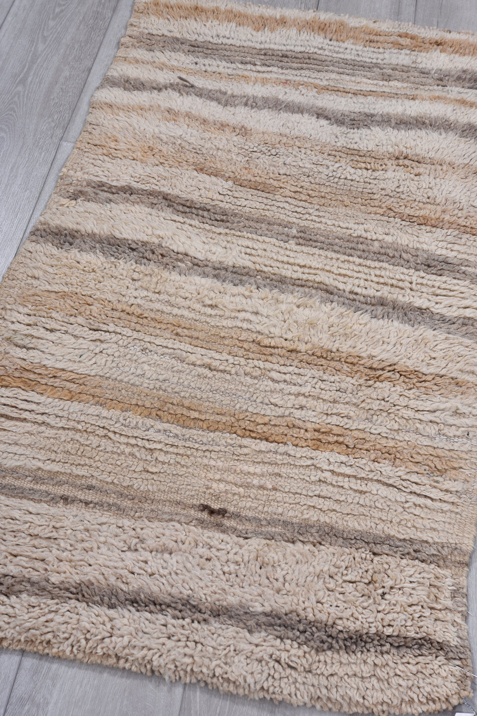 2' x 4' one-of-a-kind handmade vintage Moroccan small size rug. Color palette: brown, gray, light gray, off-white, pink