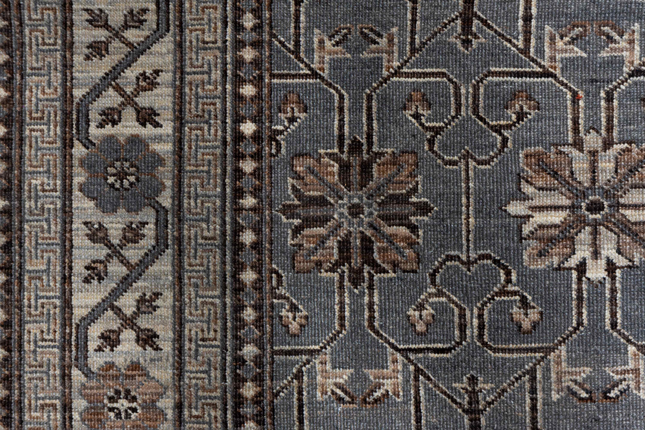 5' x 7' one-of-a-kind handmade vintage Khotan rug. Color palette: brown, dim gray, gray, light gray, off-white, pink