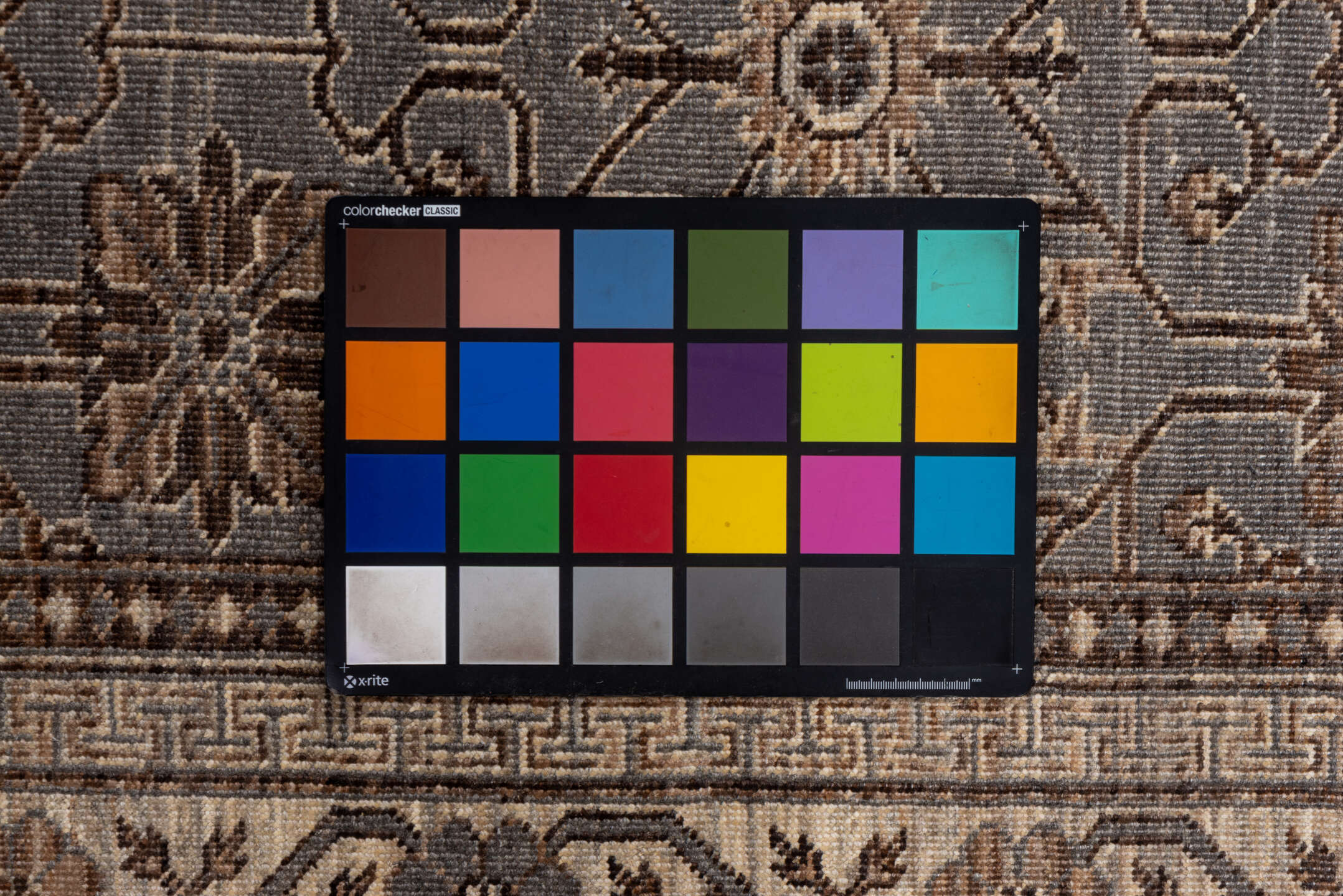 5' x 7' one-of-a-kind handmade vintage Khotan rug. Color palette: brown, dim gray, gray, light gray, off-white, pink