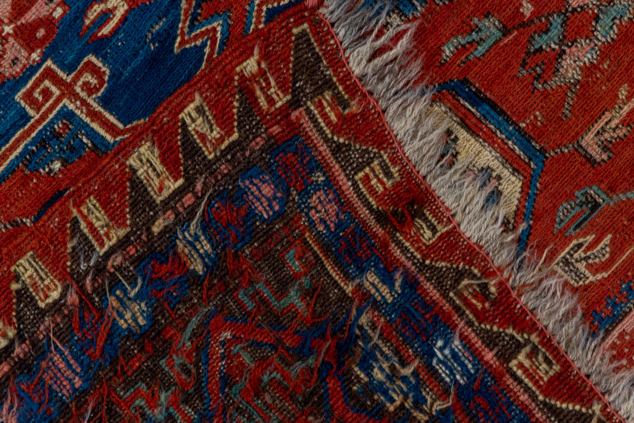 4' x 6' one-of-a-kind handmade vintage Sumak small size rug. Color palette: blue, brown, gray, light gray, pink, red